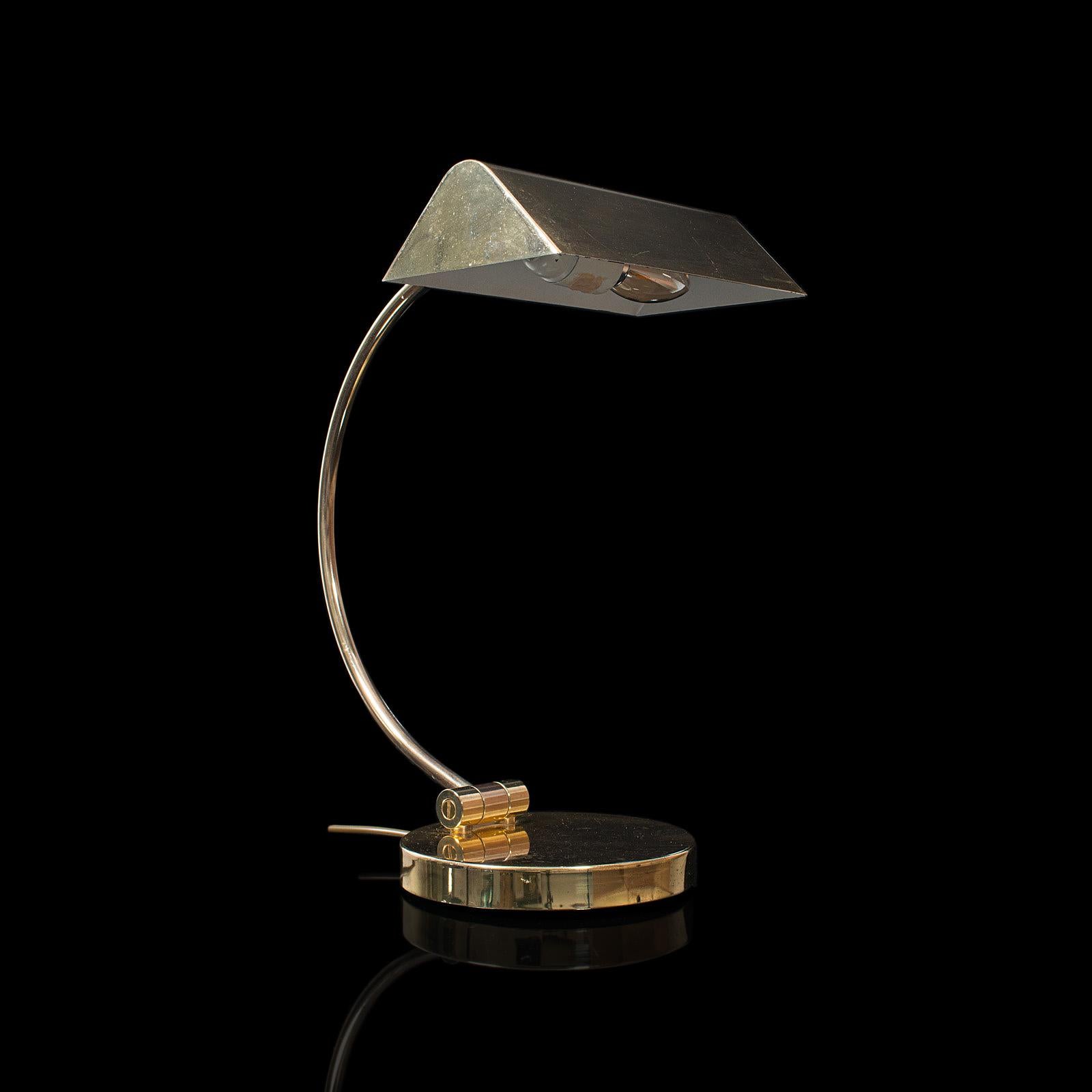 This is a vintage barrister's lamp. A Continental, brass banker's desk light, dating to the late 20th century, circa 1970.

Versatile desk lamp with appealing finish
Displaying a desirable aged patina with pleasing light tarnishing commensurate