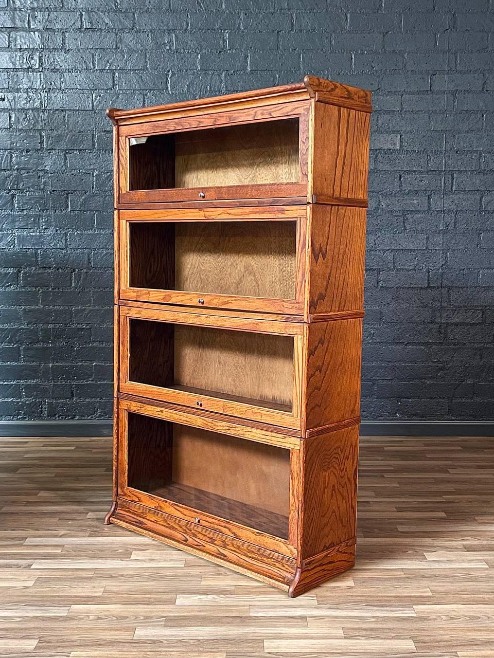 Condition: Original Vintage Condition 

Materials: Quarter-Sawn Oak, Original Glass Doors

This vintage Mission-style barrister bookcase, crafted in the United States during the 1970s, showcases the timeless beauty of quarter-sawn oak with rich