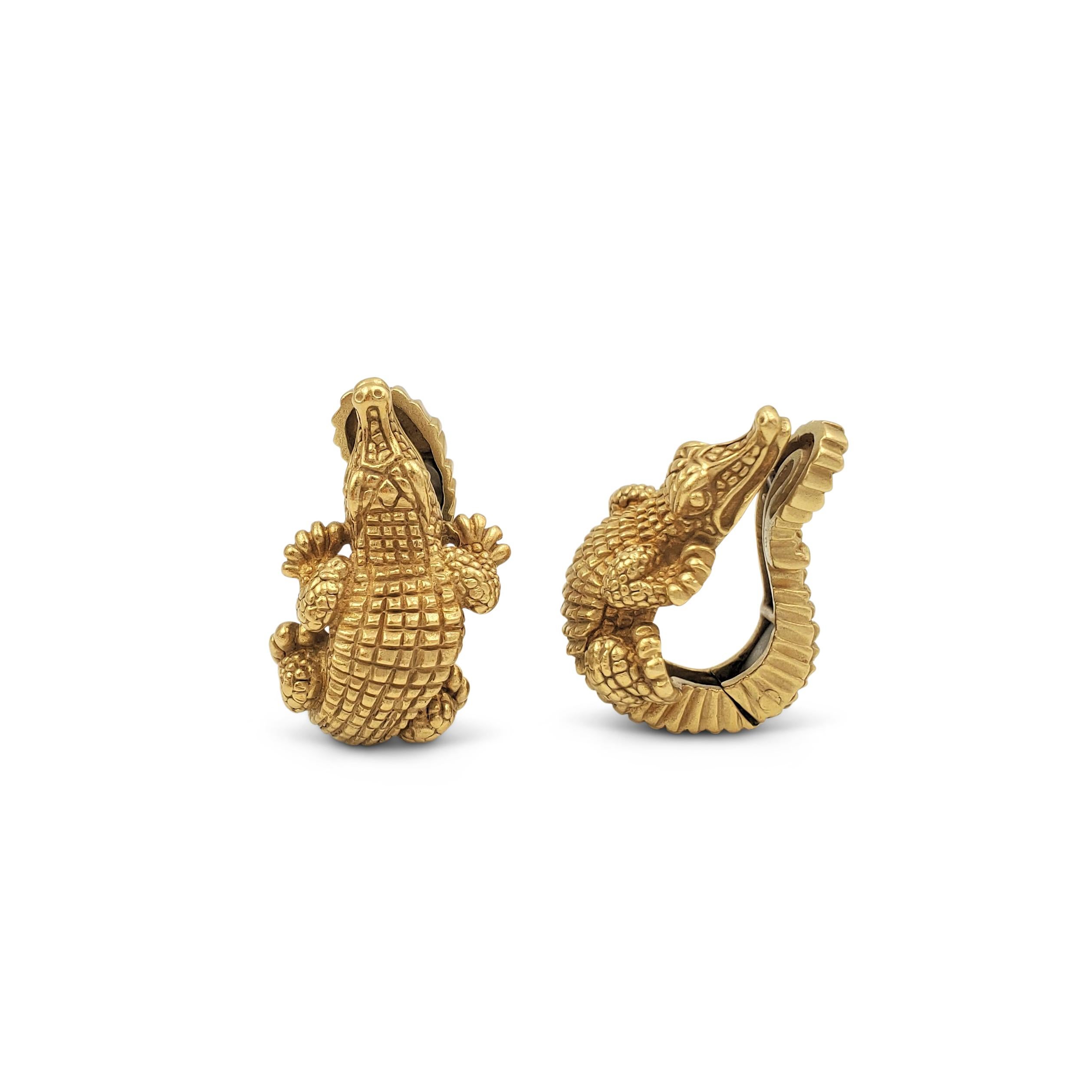 A pair of authentic and iconic vintage Barry Kieselstein-Cord alligator earrings crafted in matte 18 karat yellow gold. Signed Kieselstein-Cord, 1997, 750, with hallmarks. Clip backs without posts. The earrings are not presented with the original