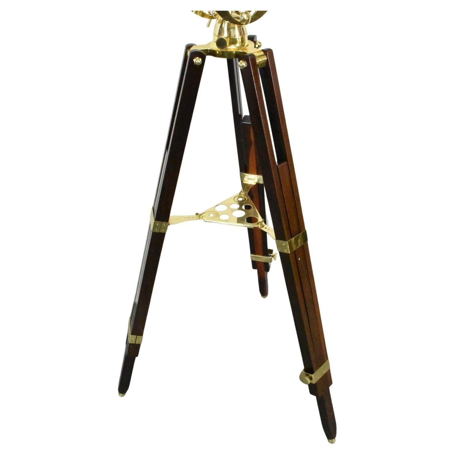 An exceptional vintage Barska Anchormaster AE 10824 brass telescope with quality mahogany tripod legs that extend. Includes 