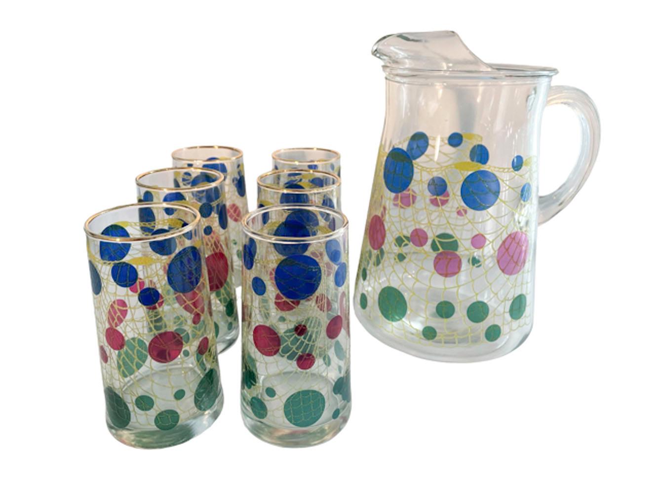 Vintage Bartlett-Collins pitcher and 6 highball glasses in the 'Gibraltar' pattern, decorated with translucent green, red and blue dots of various size arranged on a raised yellow net, giving the impression of glass floats on a fishing net.
