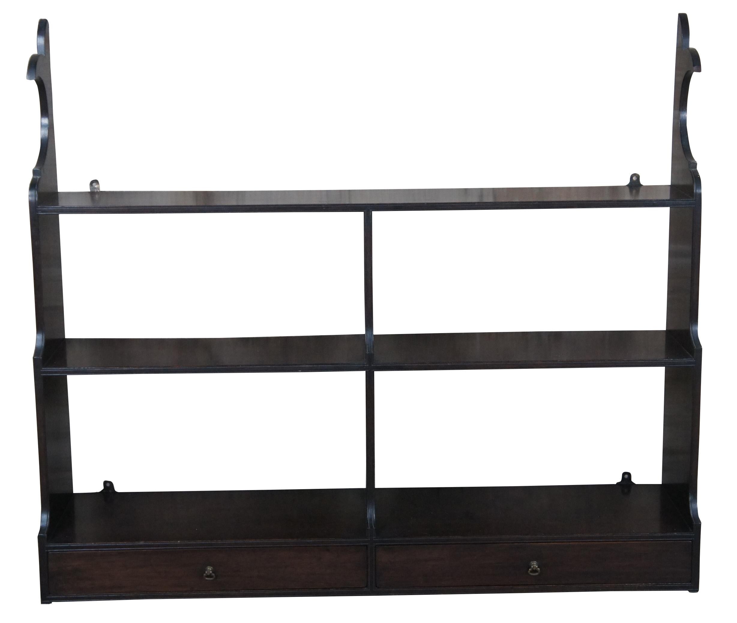 Vintage wall hanging shelf from Bartley Collections, circa last quarter 20th century.  Made from mahogany in chippendale styling with 3 shelves and 2 lower drawer.  Each drawer features a brass pull and is made from oak with dovetailed