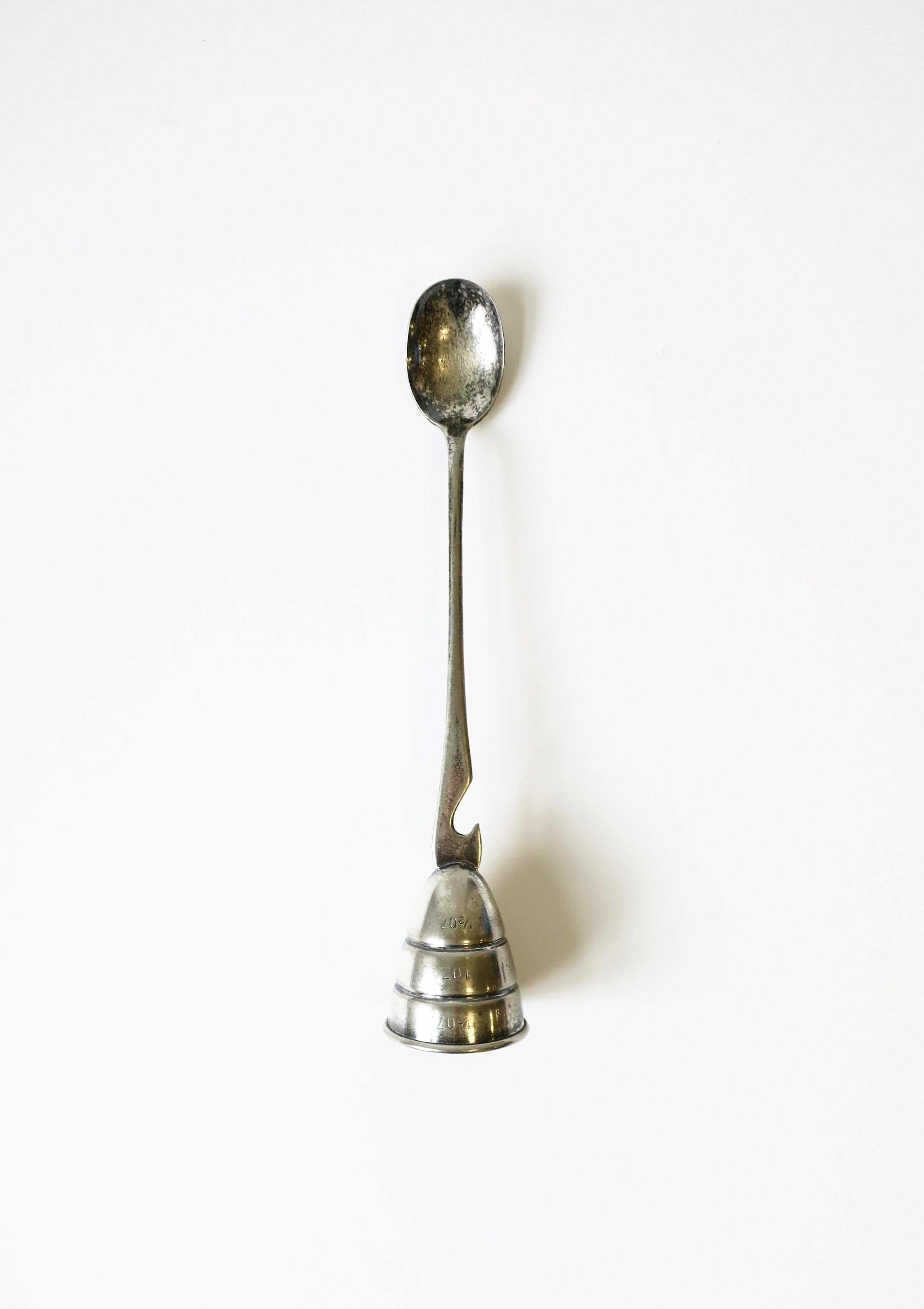 A vintage Mid-Century Modern silver-plate jigger and bottle opener, circa mid-20th century, USA. A great measuring tool for cocktails and bottle opener for any bar, bar cart, bartender mixologist. Dimensions: 1.75