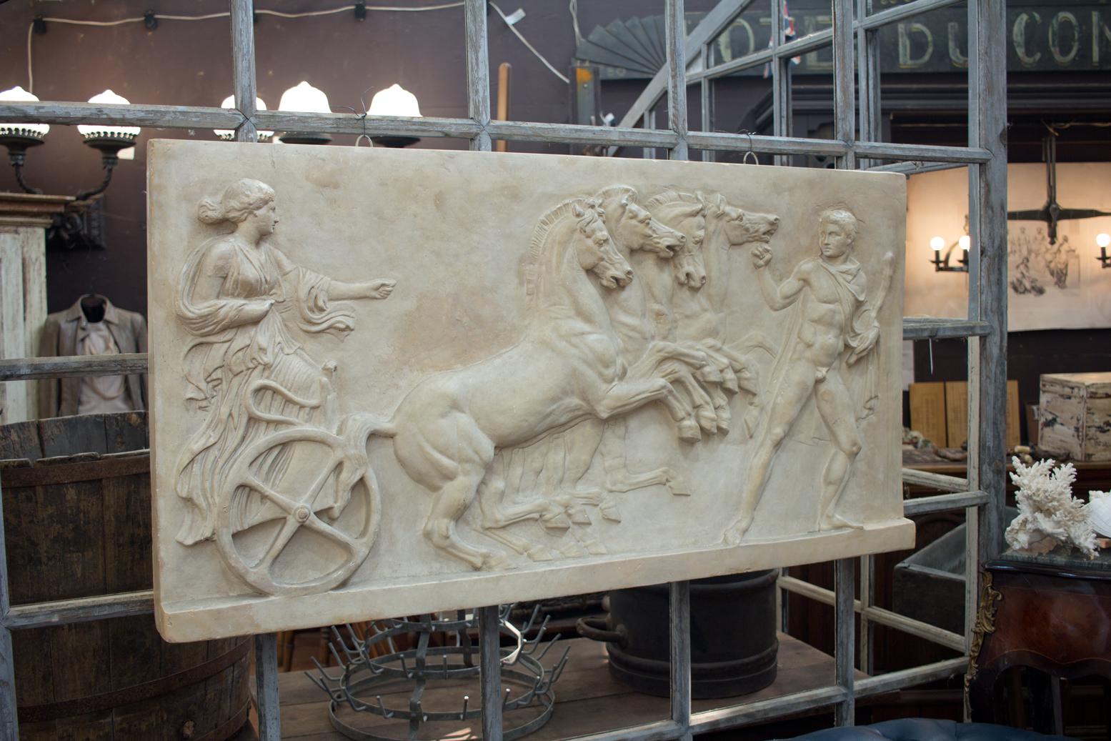 Substantial stunning vintage bas relief replica from the Louvre, Paris (disk on back). It depicts Eos, the goddess of dawn, driving her quadriga chariot. Her lover (Tithonus) is at the horses’ heads. The original 1st century marble Herculaneum is in