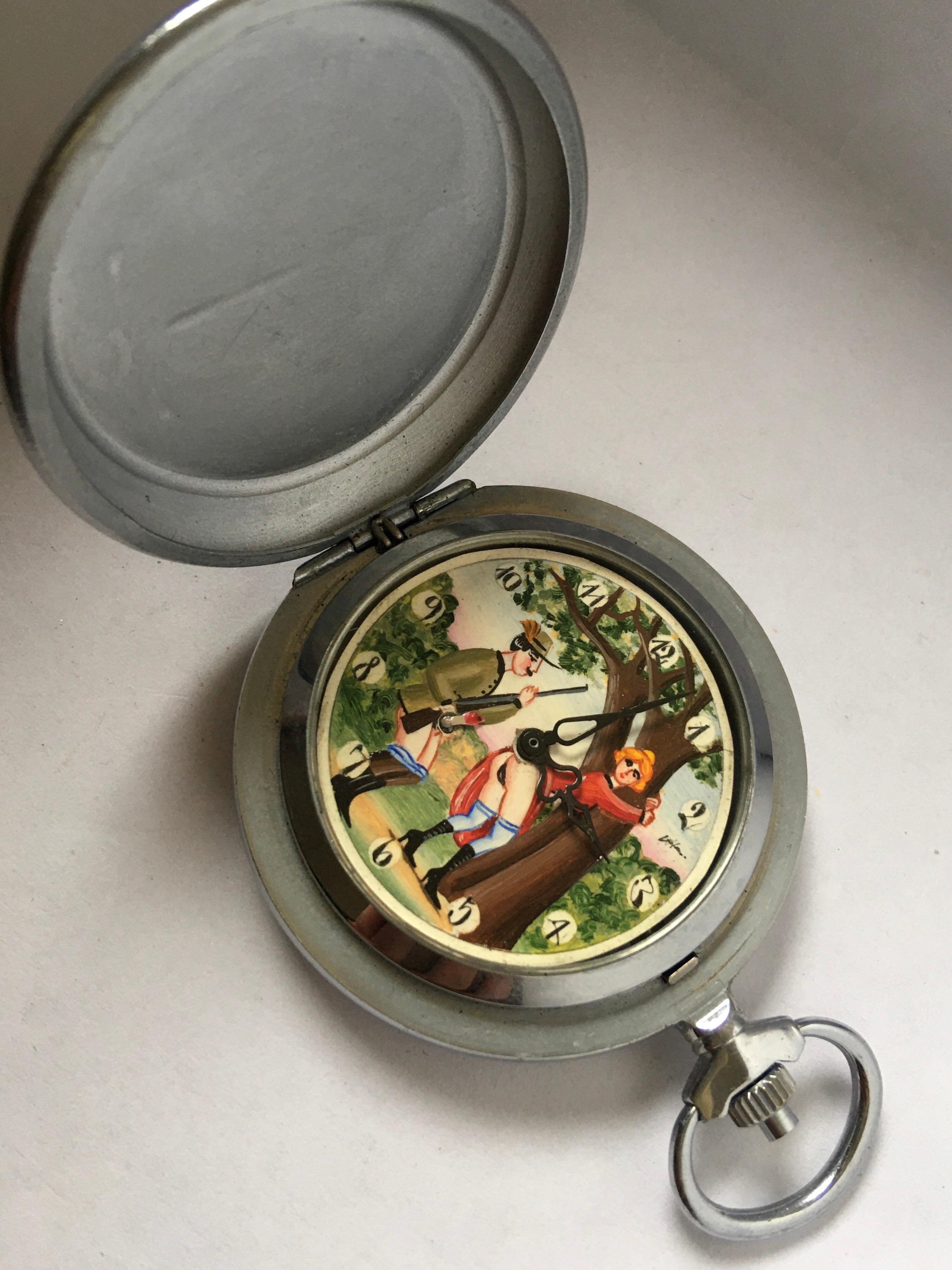 This beautiful vintage hand winding pocket watch is in good working condition and it is ticking and running well. Visible signs of ageing and wear with light scratches on the watch case as shown. The watch case is tarnished as shown. Please study