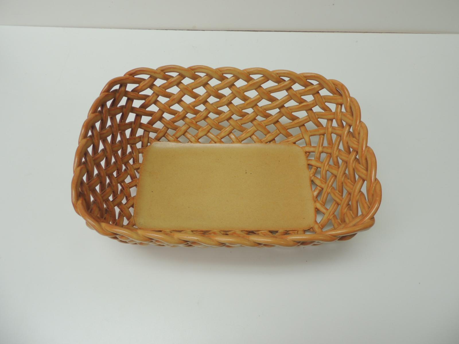 Vintage basket weave ceramic bread orange Italian basket
Vintage basket weave ceramic bread basket with orange lattice work and hand painted. Open-word design from Bassano, Italy (stamped Primogi.)
Size: 8 x 11 x 4.5.
 
