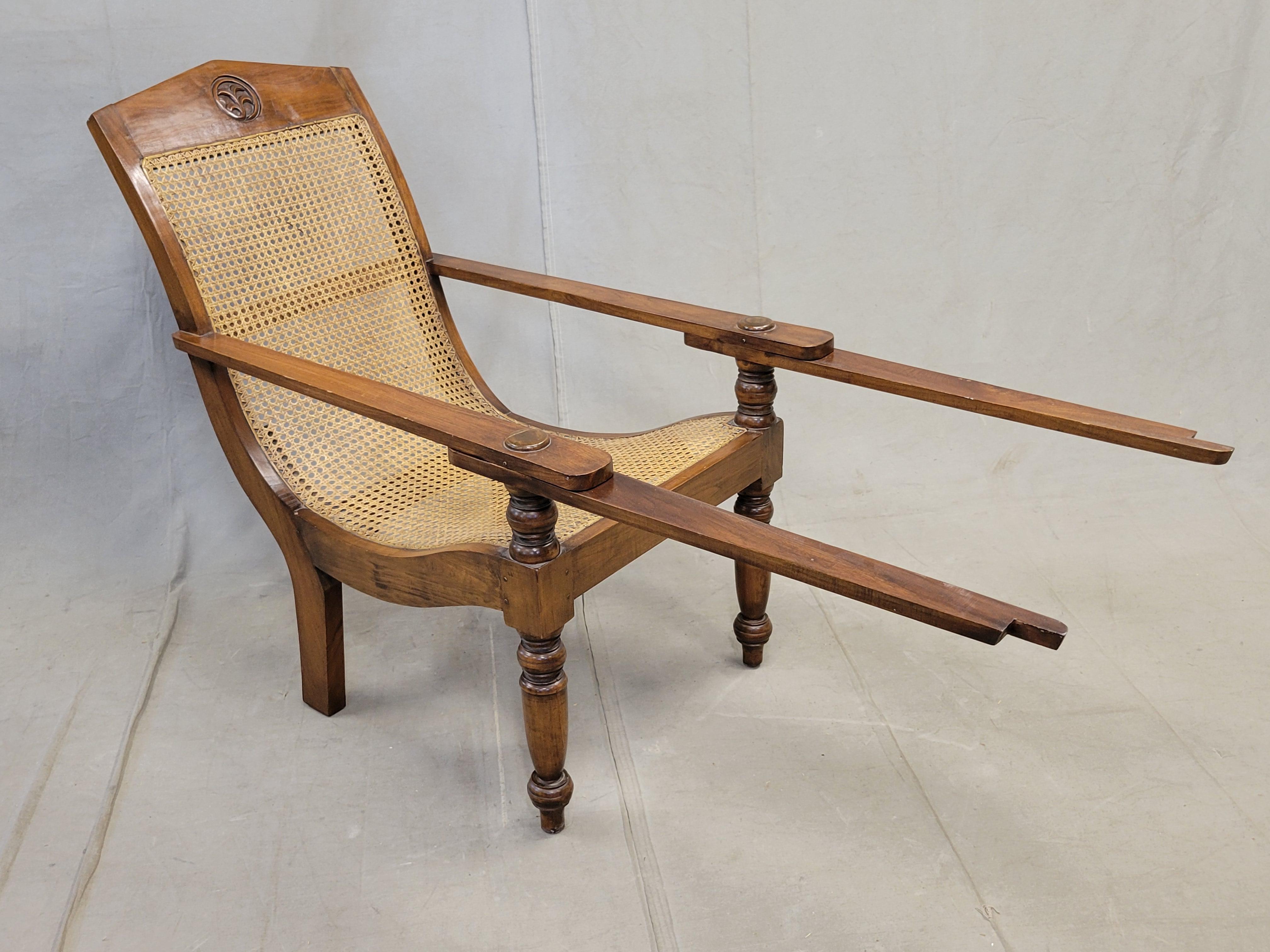 Dutch Colonial Vintage Bauer International Teak Caned Plantation Chair With Extension Armrests For Sale