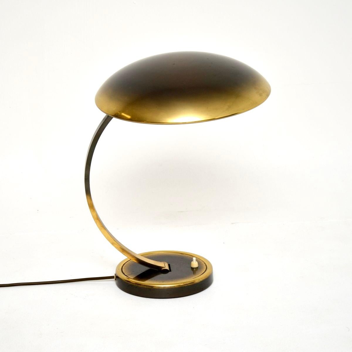 A very stylish and extremely well made vintage Bauhaus brass desk lamp by Christian Dell for Kaiser Leuchten. This was made in Germany, it dates from around the 1960’s.

The quality is amazing, the brass frame has a lovely patina and this has a
