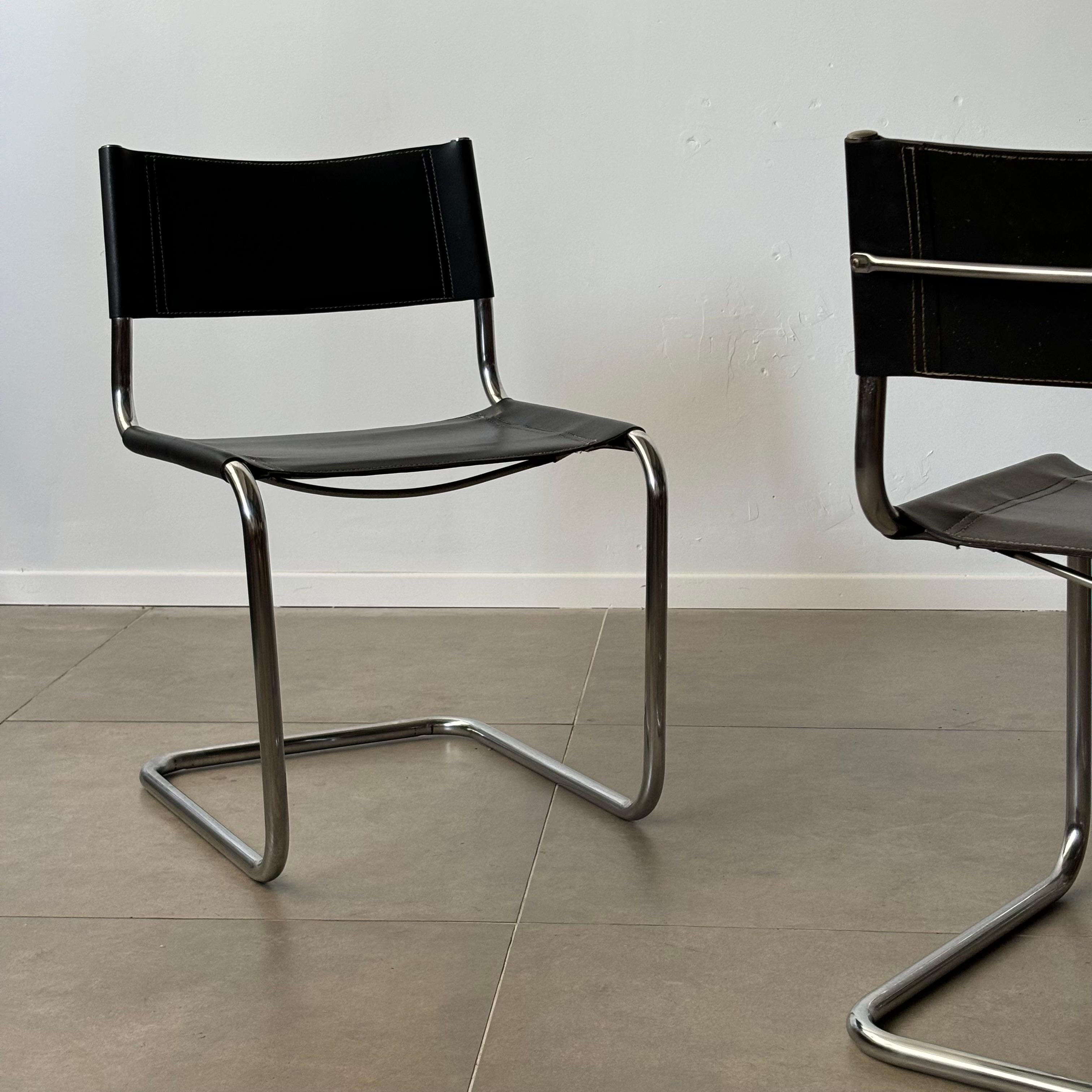 Only 3 available
•
The vintage black leather Bauhaus chair by Mart Stam, re-edited in the 1970s in Italy, is a stunning example of modernist design that continues to captivate collectors. Originally conceived by Stam, a pivotal figure in the Bauhaus