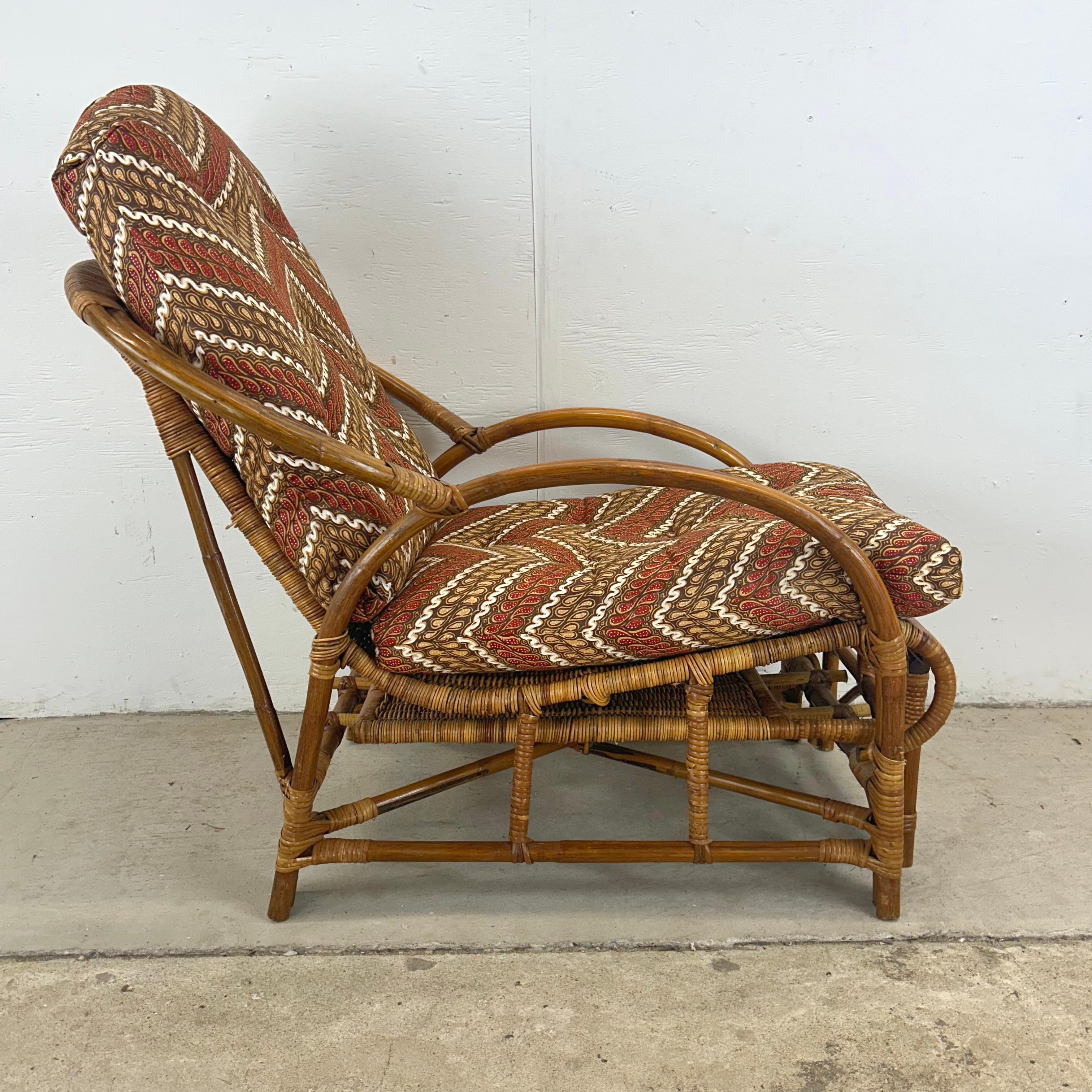 Relax in style with this stunning Vintage Bauhaus Rattan Lounge Chair, featuring a built-in footrest for ultimate comfort. This chair is a beautiful example of vintage craftsmanship, with its natural rattan frame and intricate weaving. The built-in