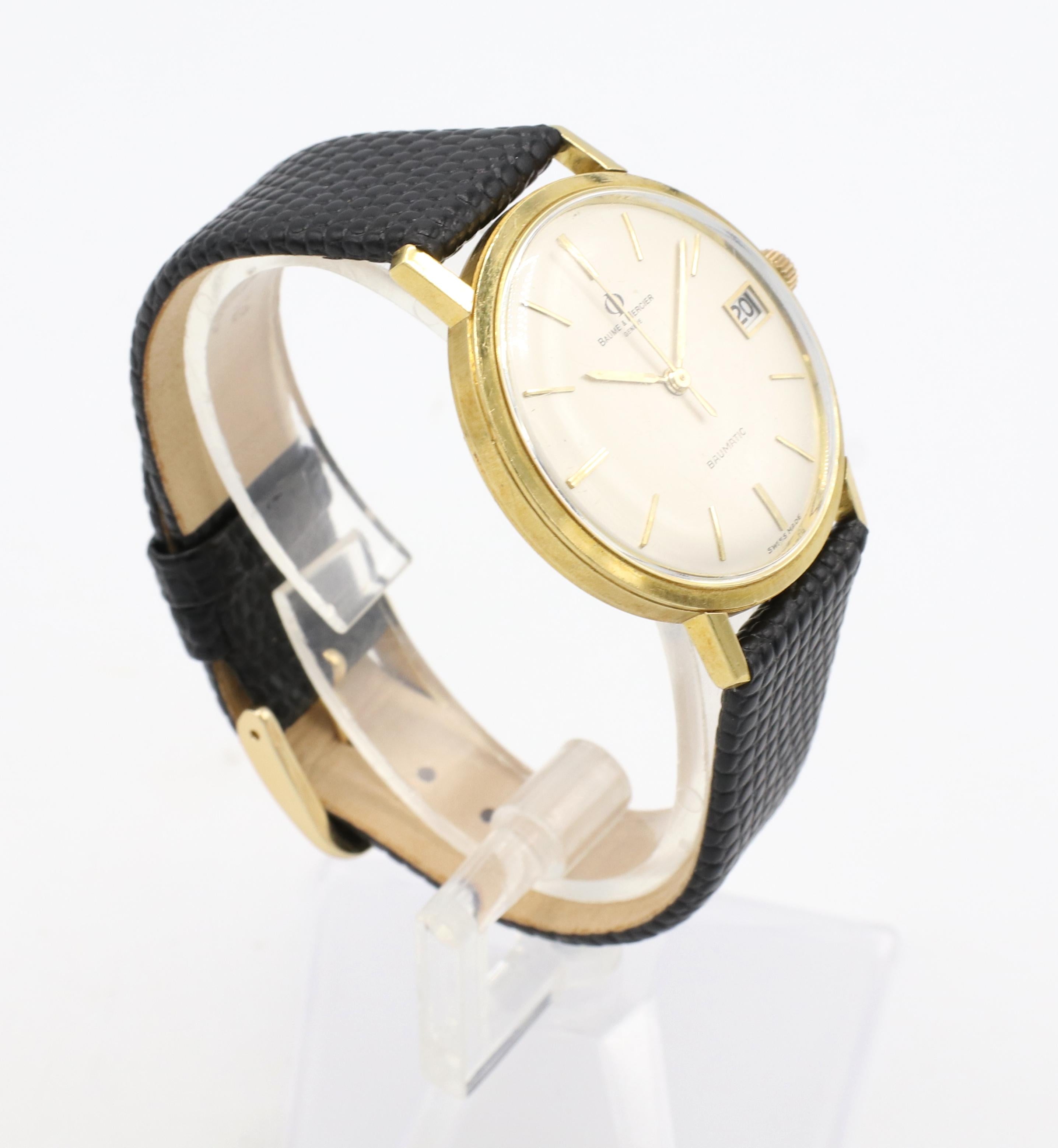 Vintage Baume & Mercier Baumatic  18 Karat Yellow Gold Leather Strap Wrist Watch
Metal: 18k yellow gold
Case size: 34mm
Reference: 3188 
Movement: Automatic
Dial: Silver
Strap/Buckle: New 