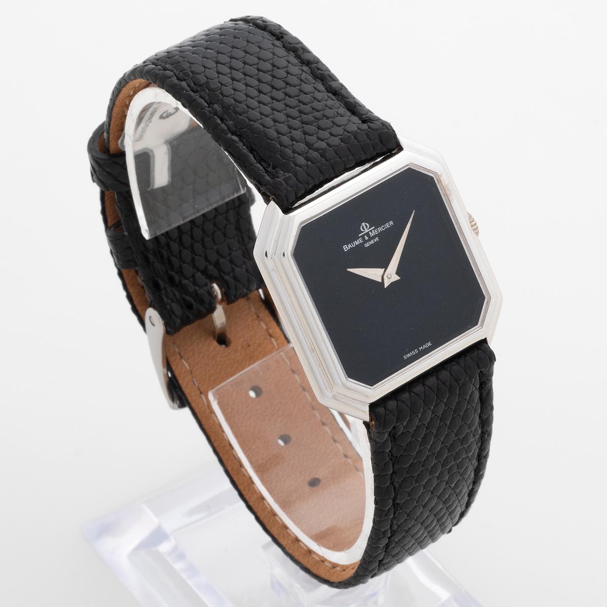 Our stunning vintage manually wound Baume & Mercier dress watch features an attractive onyx black dial and 28mm  18k white gold case, and is presented in outstanding condition. A quality leather strap and steel tang buckle have been fitted. We date