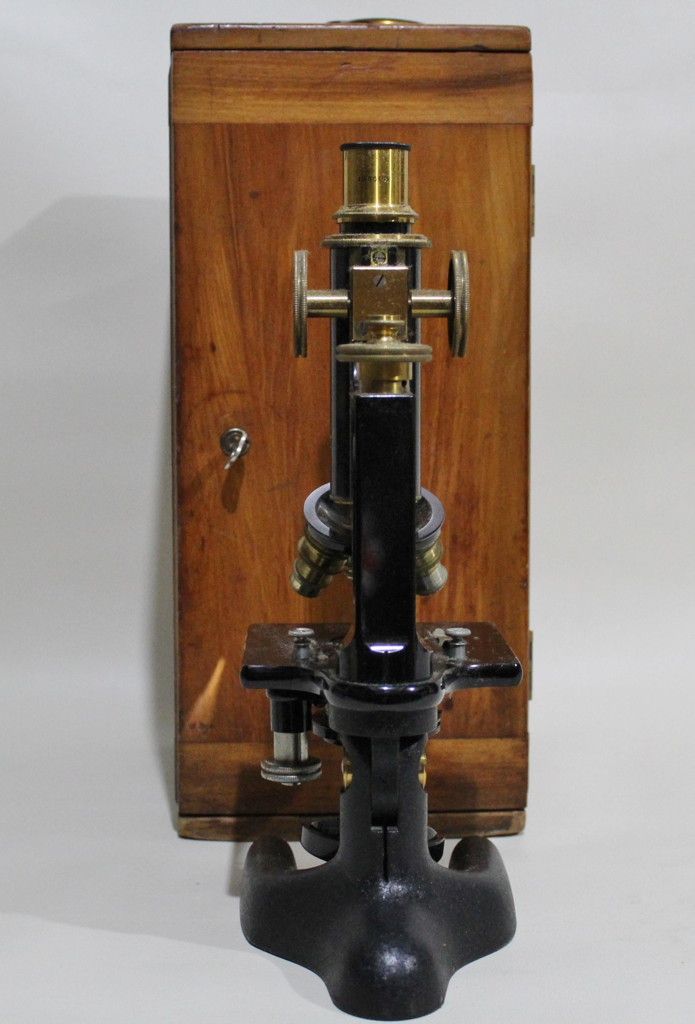 vintage microscope in wooden box