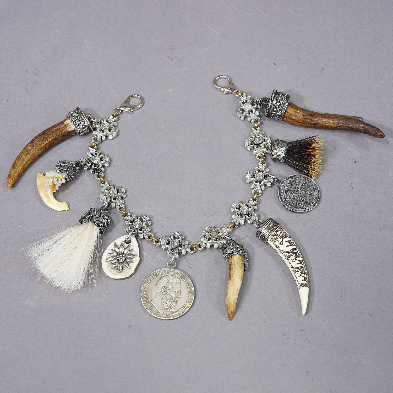 Vintage Bavarian Traditional Costume Jewelry Charivari with Hunting Pendants

A Bavarian Charivari from the middle of the 20th century. A beautiful piece of historical Bavarian folk art jewelry, a real collector's item. A charivari is a traditional