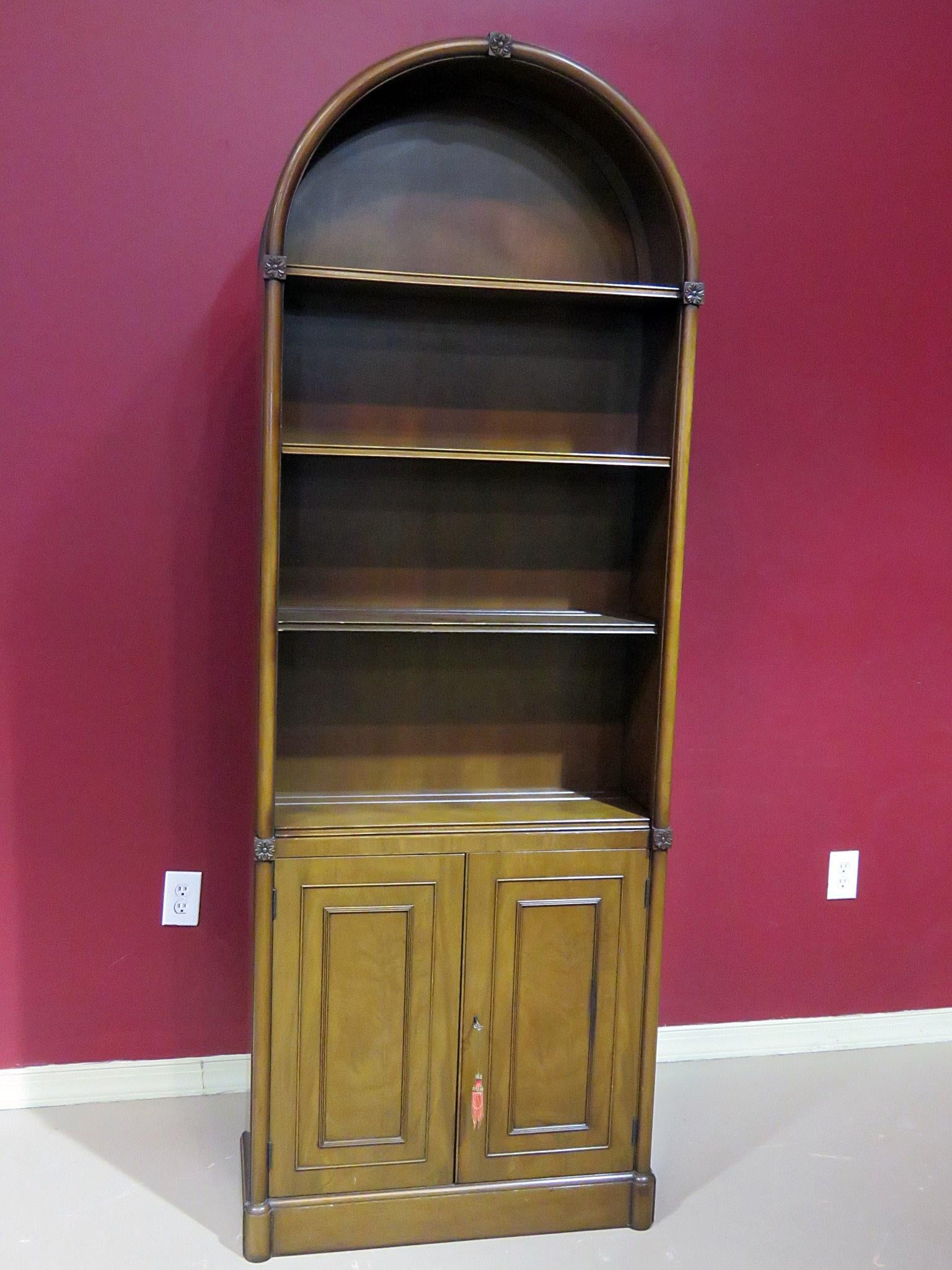 Vintage Beacon Hill Regency style arched mahogany bookcase with 3 shelves over 2 doors.