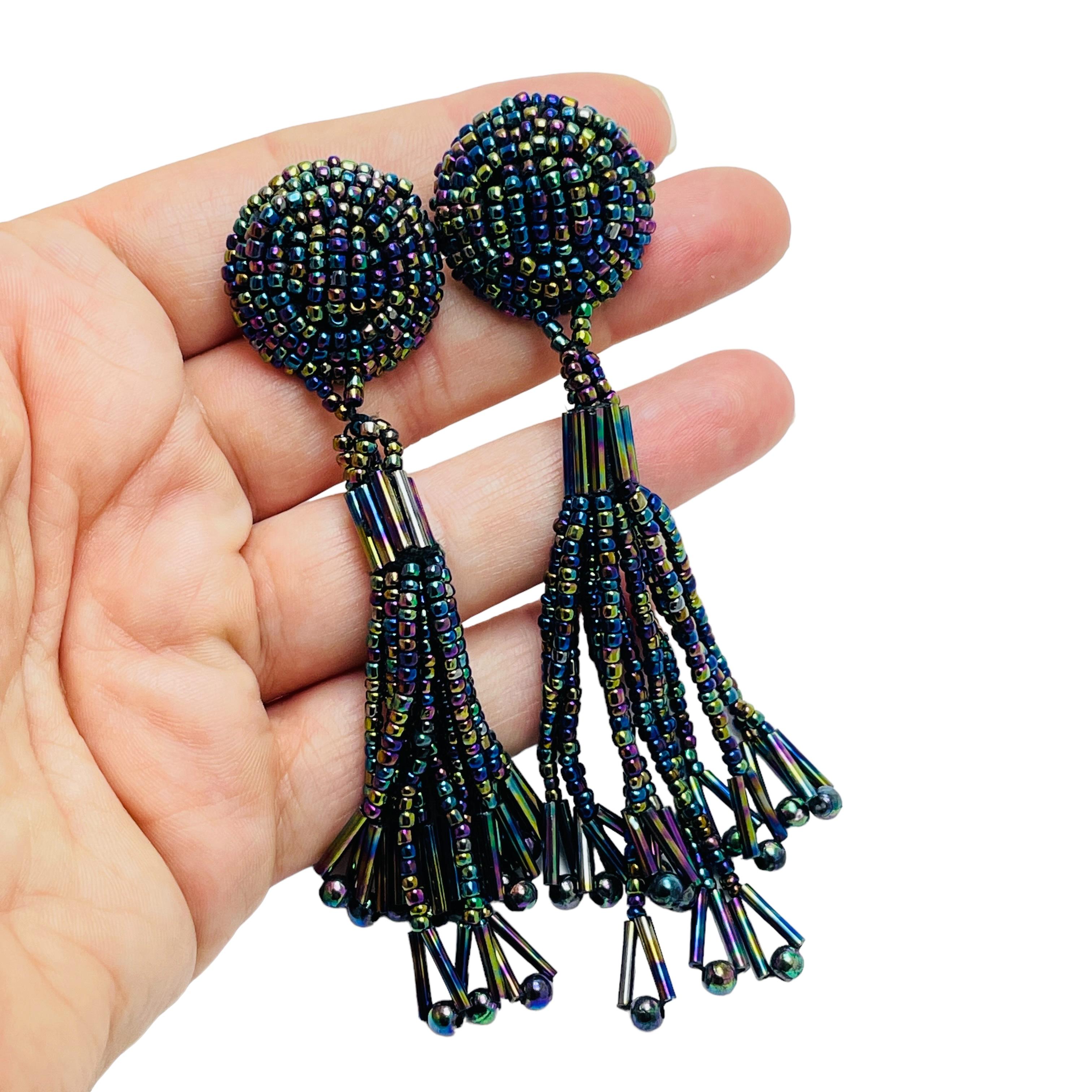 DETAILS

• unsigned

• silver tone with ab black seed beads

• vintage clip on earrings 

MEASUREMENTS  

• 3 3 /4