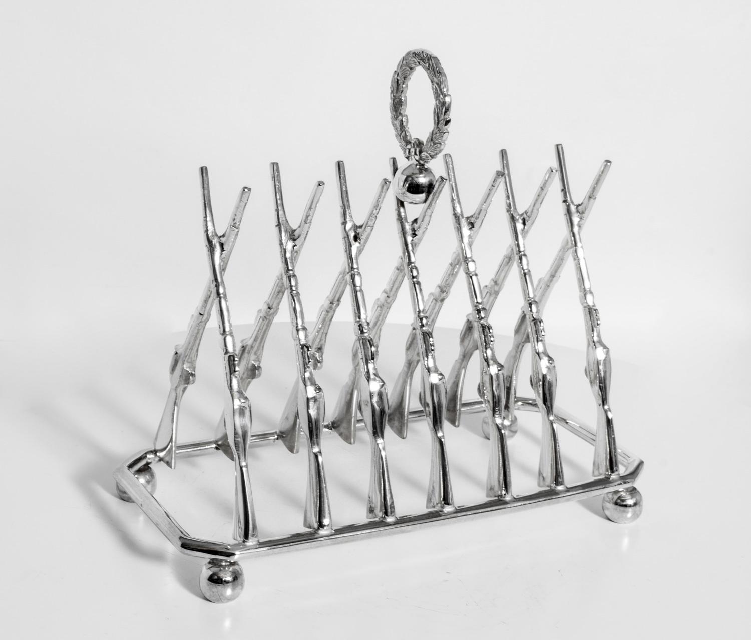 This is a delightful vintage silver plated crossed rifle toast rack dating from the late 20th Century.
 
The toast is held in place by crossed rifles.

The craftsmanship and finish are of the highest quality.

Add touch of elegance to your