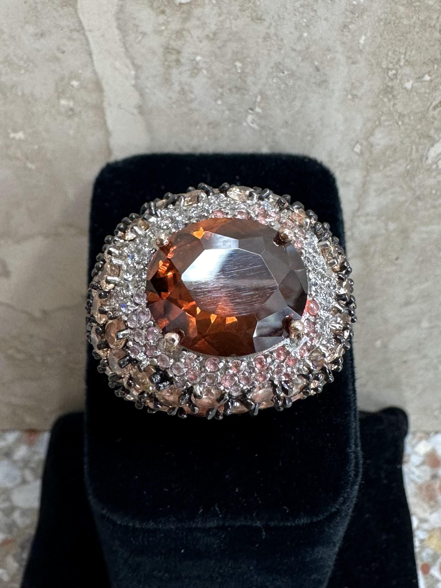 A Vintage Bedazzled Rhinestone Ring (BYS) is a stunning piece of jewelry that exudes glamour, elegance, and vintage charm. Rhinestones, often used to imitate diamonds, sparkle and shine, making them perfect for statement rings or special occasion
