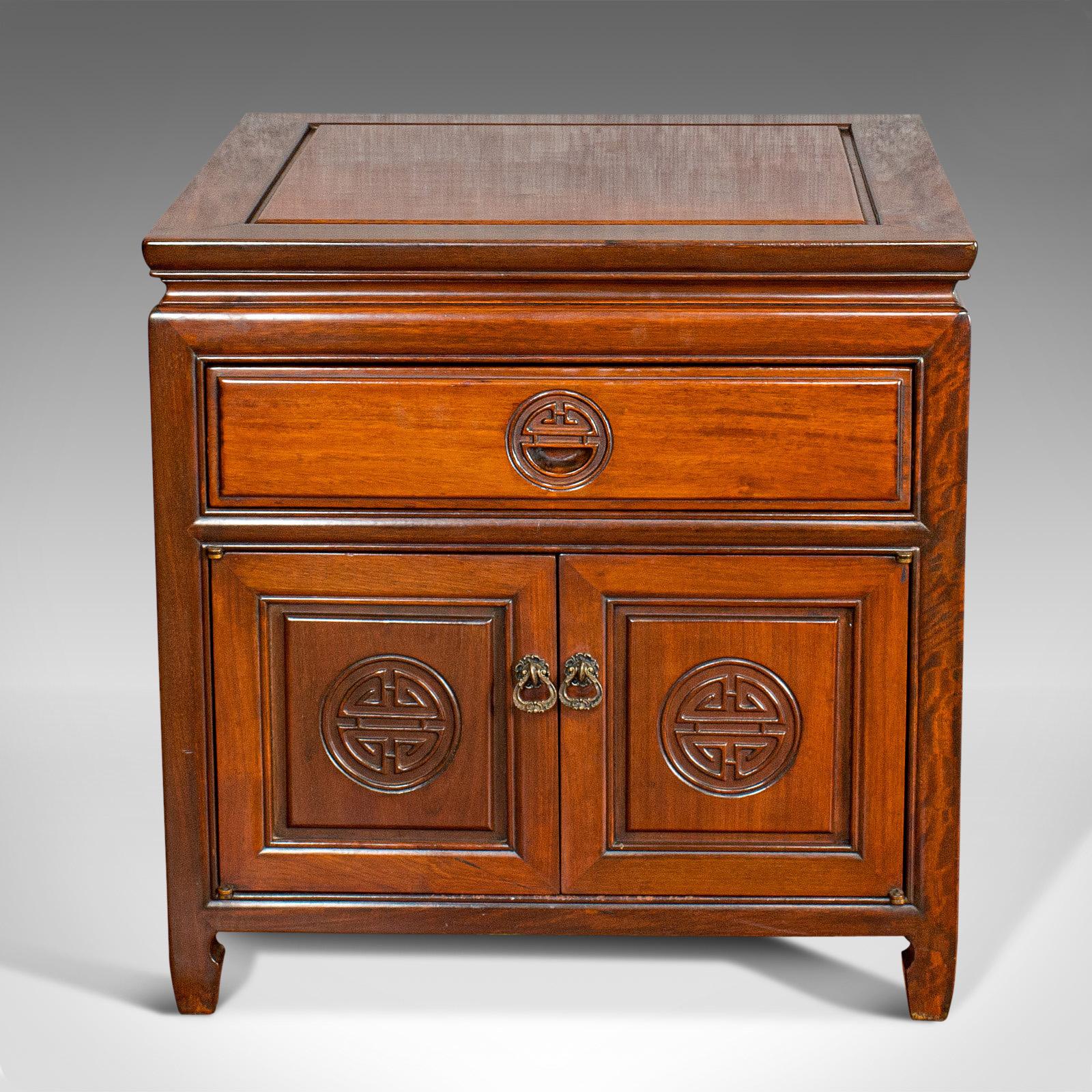 This is a vintage bedside cabinet. An Asian, teak low side stand, dating to the late 20th century, circa 1990.

Pleasingly square proportions
Displaying a desirable aged patina
Quality teak shows fine grain interest
Rich russet hues to the wax