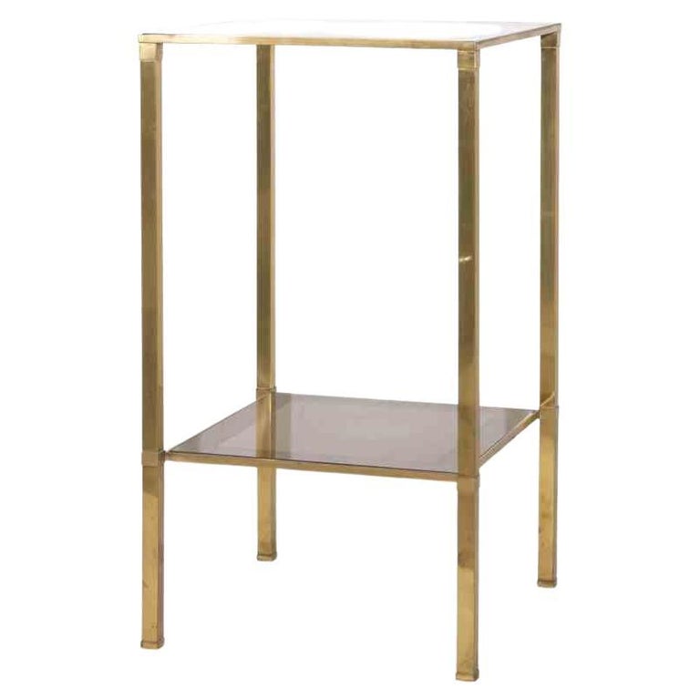 Vintage Bedside Table is an original design item realized in the 1970s.

An elegant brass table with two shelves in glass.