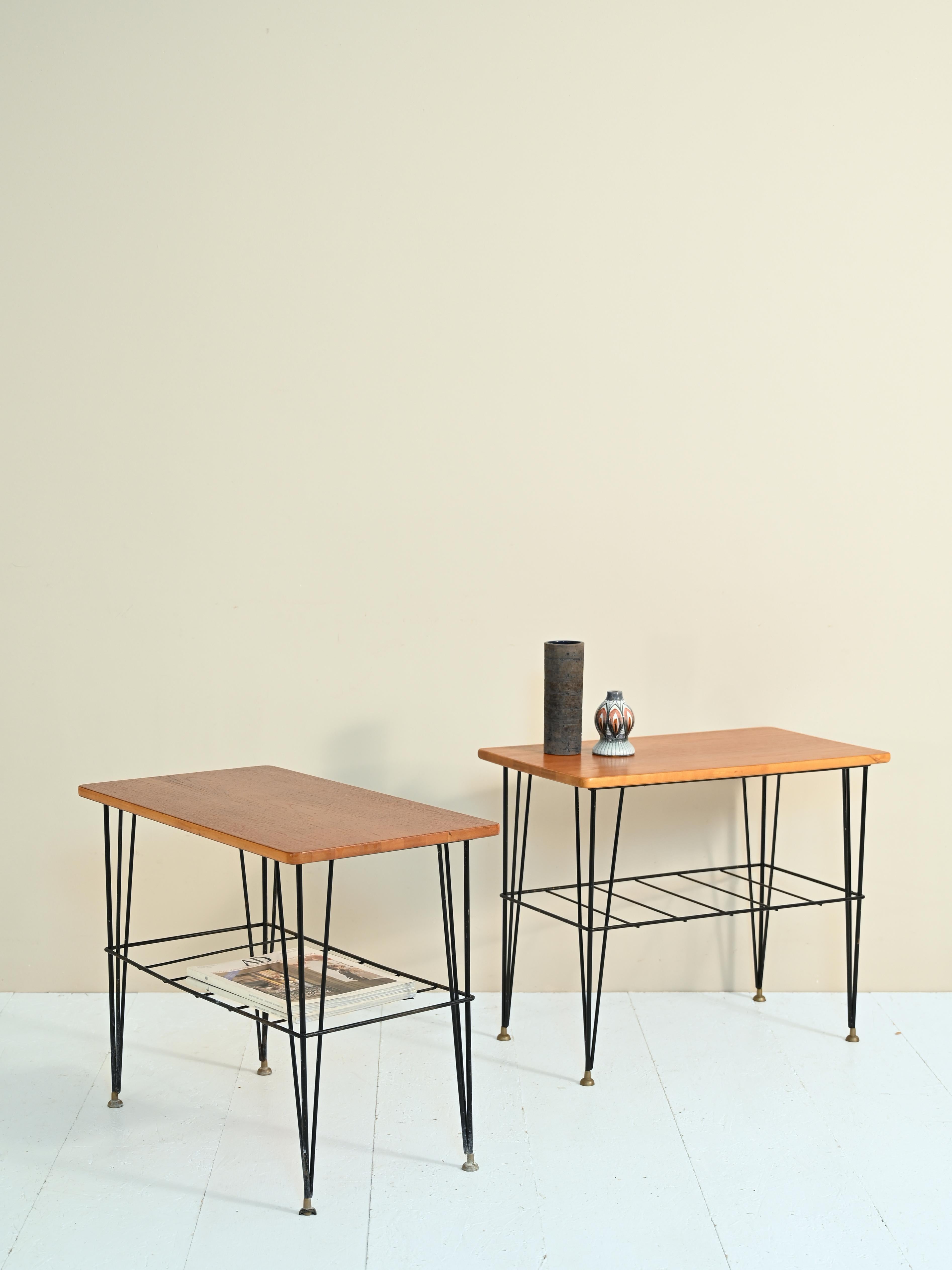 Pair of bedside tables/coffee tables in teak and metal with a clear mid-century design from Northern Europe.

These small-sized vintage coffee tables can be used as bedside tables and, thanks to the presence of a second shelf, are suitable for use