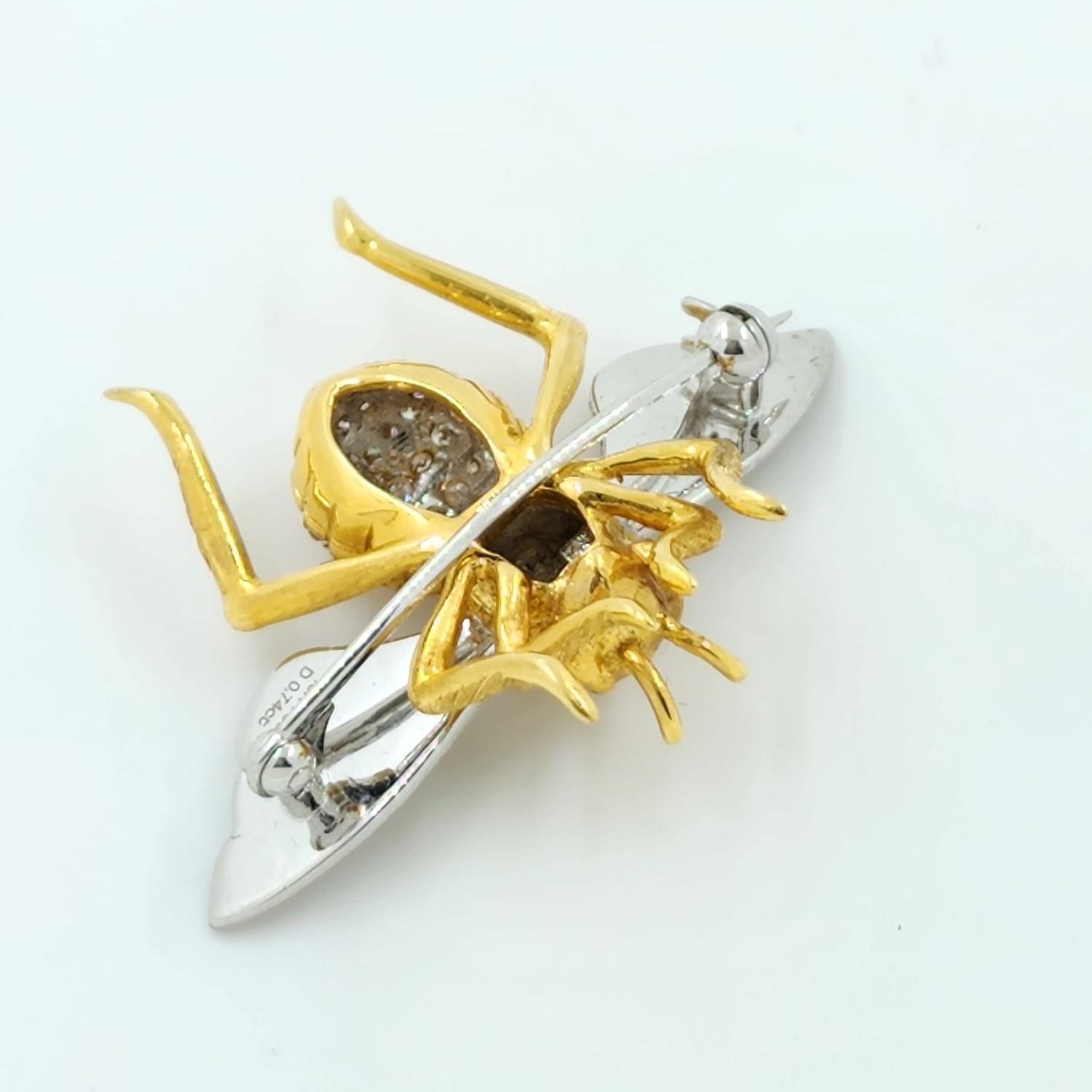 Bee lover be alert ! This bee brooch / pin is handcrafted and set in 18 karat white and yellow gold. The latter is set with 0.74 carat of brilliant cut diamonds. The wing is make with 18 karat white gold with a silky-like finishing. The bee offer