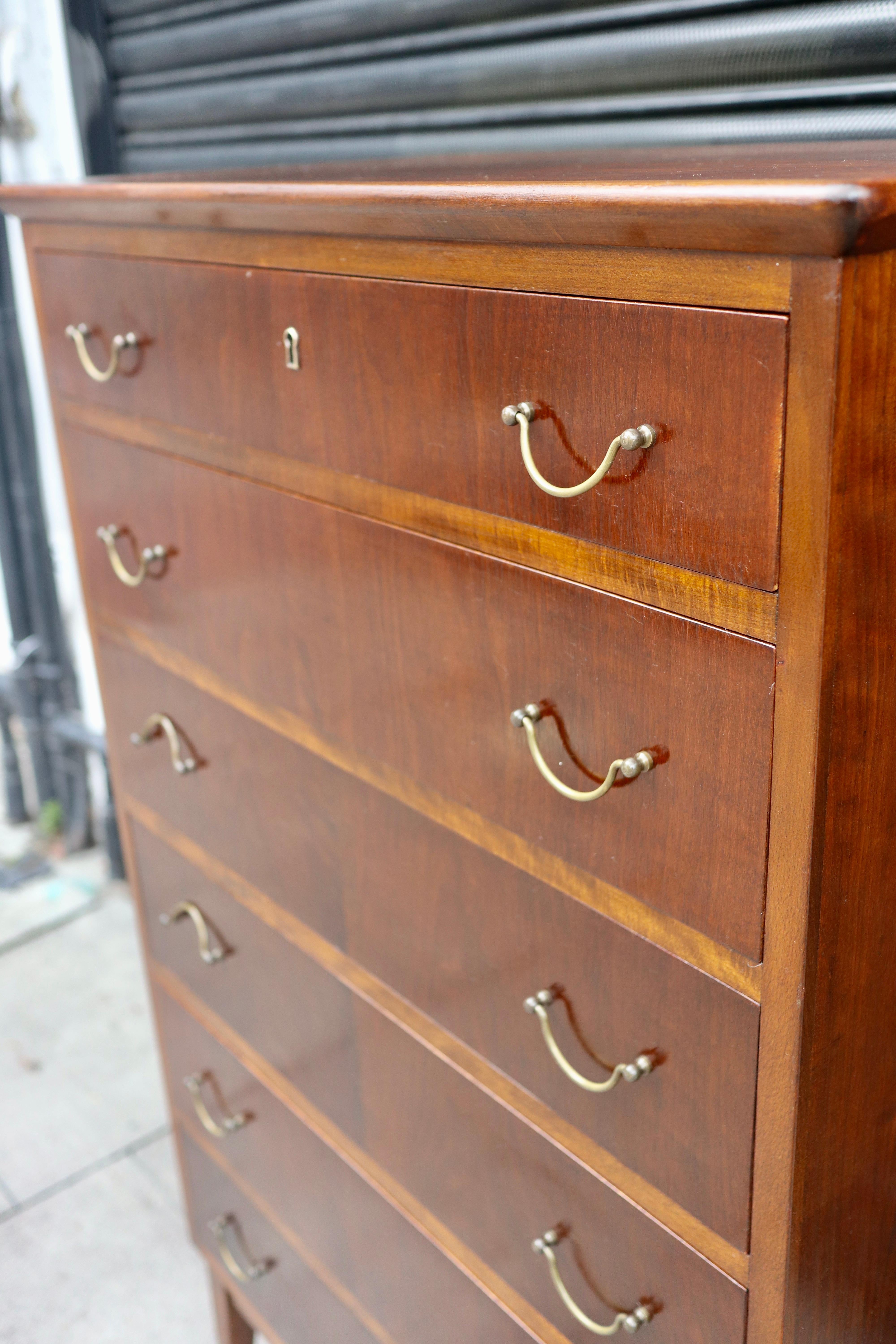 Vintage beech 1950s English 'tall boy' chest of drawers with brass handles In Fair Condition For Sale In London, GB
