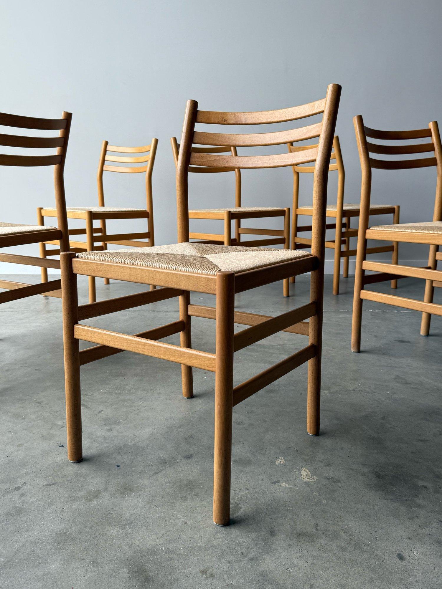 Set of six vintage beech wood with rush straw seating. Elegant and well designed. Frames are in great vintage condition with very minimal signs of hard wear. Rush seating is intact with only 3 showing some wear as shown in photos. No rips at all. In