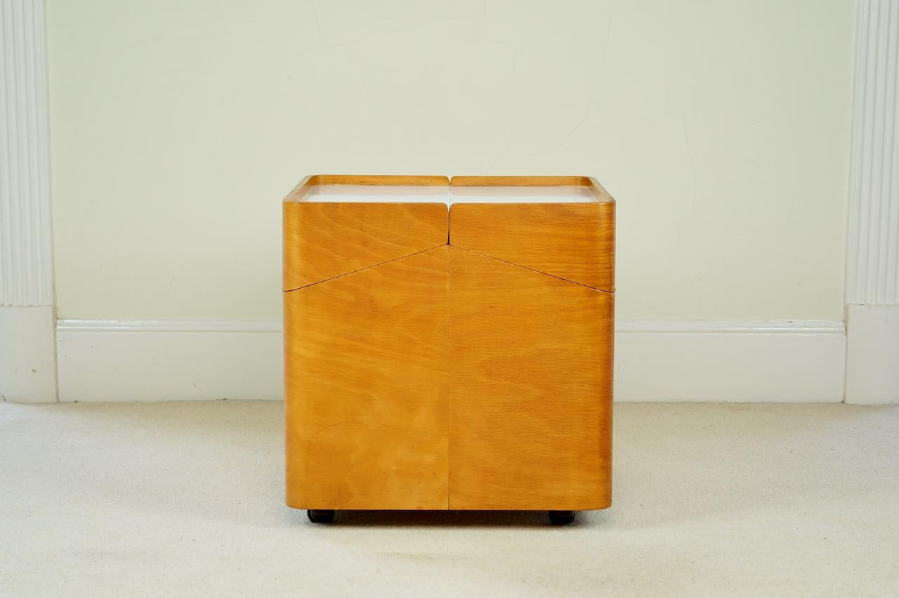 Vintage beech plywood storage table by Brian Long for John Alan Designs and chosen by the Design Centre, UK, 1960s

A versatile storage table with exposed plywood detailing, white formica surfaces for ease of use and exposed white piano hinges.