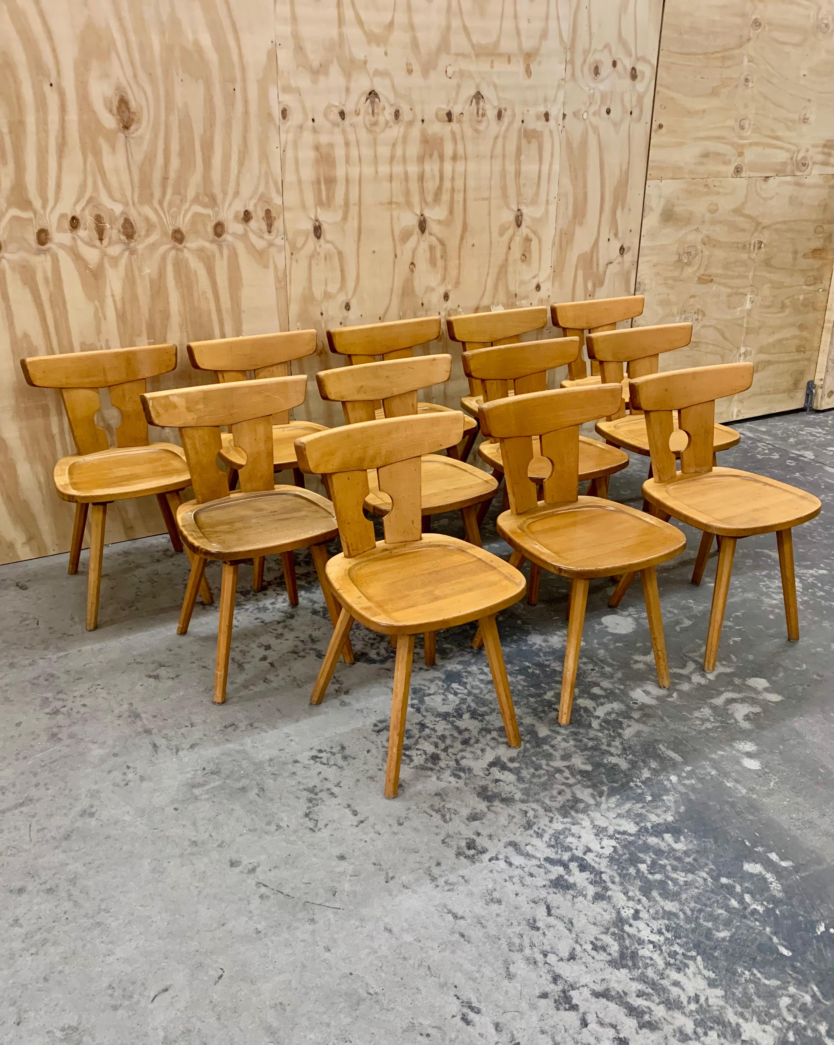Chunky and charming rustique chalet chair in light beech wood. The very comfortable French chairs dates from the 1950s and are in good condition, with wear according to age and use. 
At the moment we have 12 chairs in stock.
Price in pr. piece.
