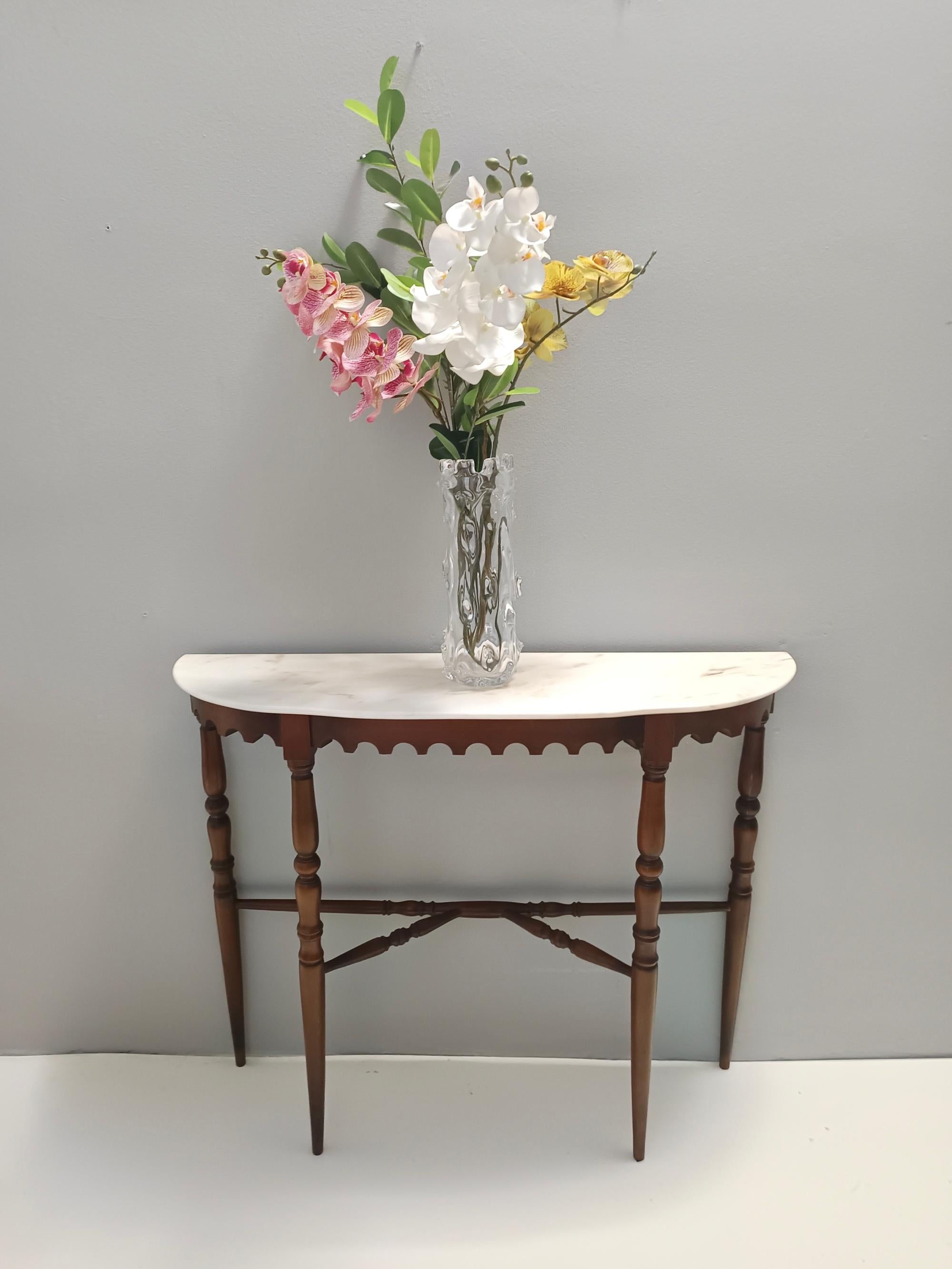 Made in Italy, 1960s.
This console table features a demilune Portuguese pink marble top and a beech frame. 
It is a vintage item, therefore it might show slight traces of use, but it can be considered as in excellent original condition and ready to