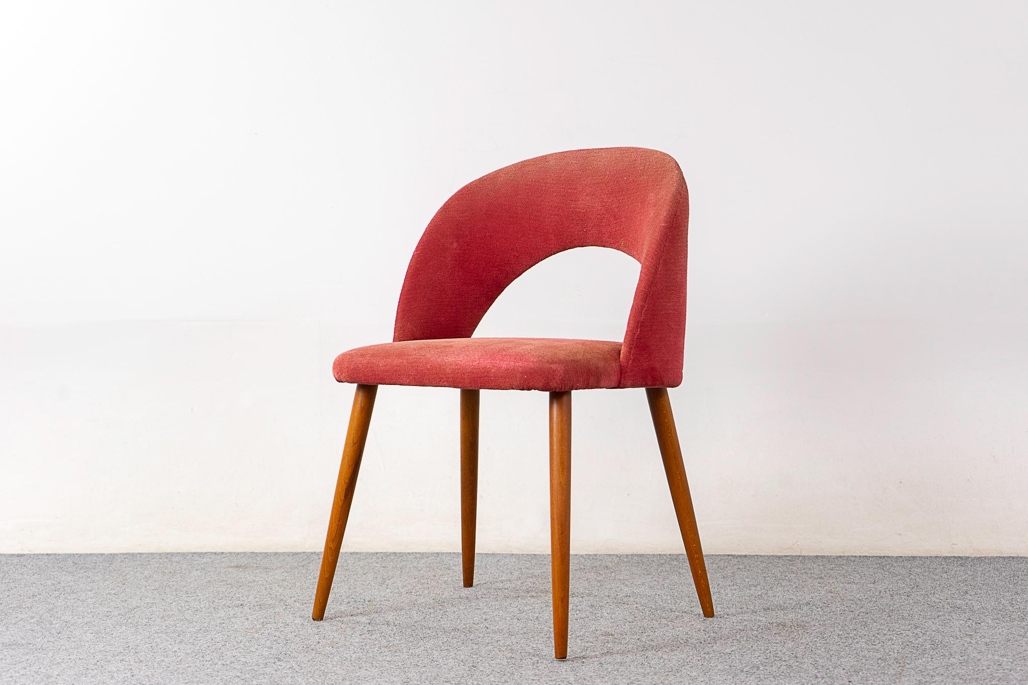 Beech mid-century side chair, circa 1950's. Beautifully arched backrest, generous seat and sleek tapered legs. Original upholstery with minor wear. 

Unrestored item being sold AS-IS.