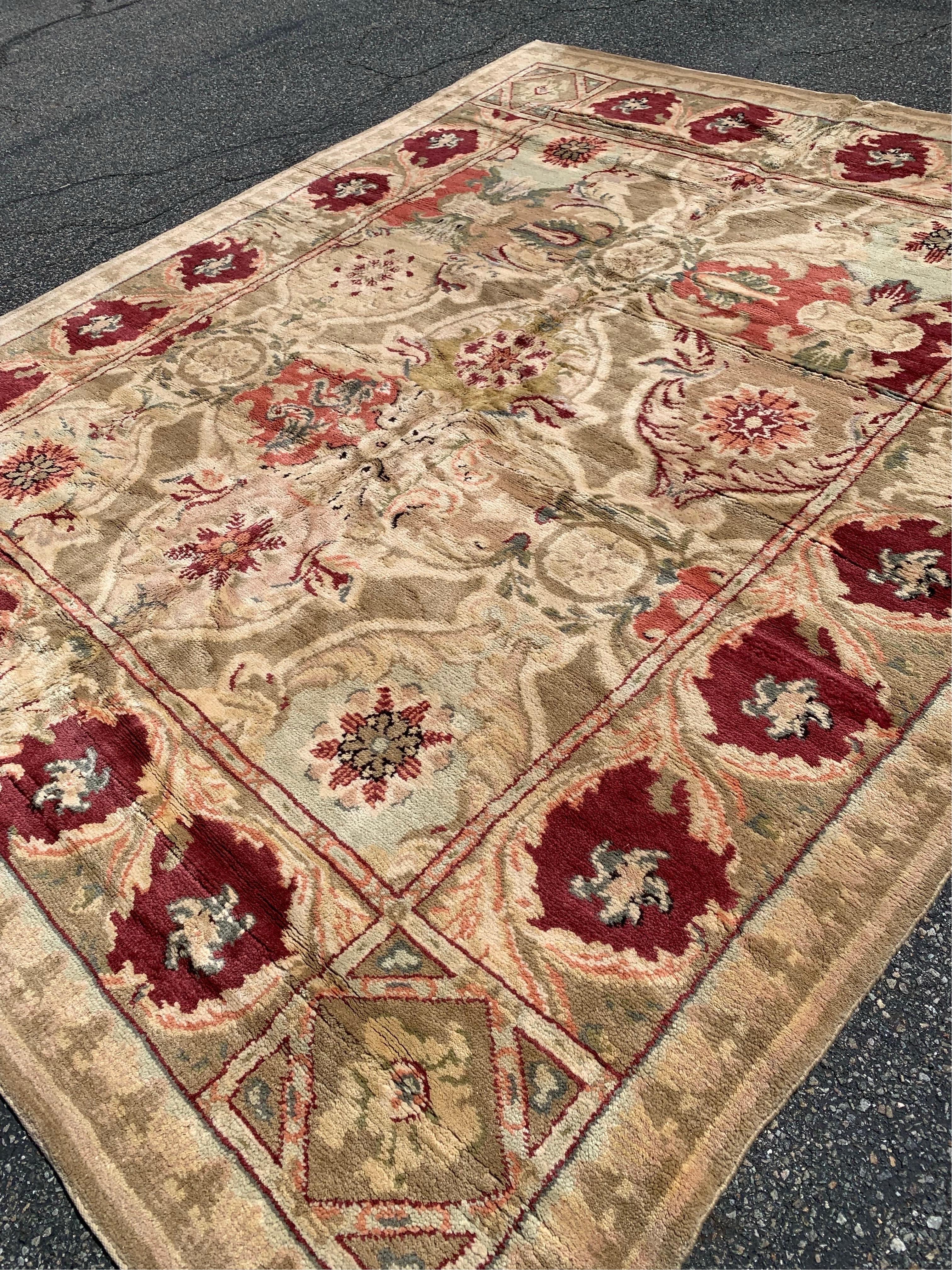 Vintage Beige and Burgundy Axminster Style Area Rug that was  handwoven in Alexandria, Egypt in 1990s. 

This one measures 8.5 x 10.2 ft  and it is new and never been used.  It is in excellent condition with a full pile.

Complimentary
