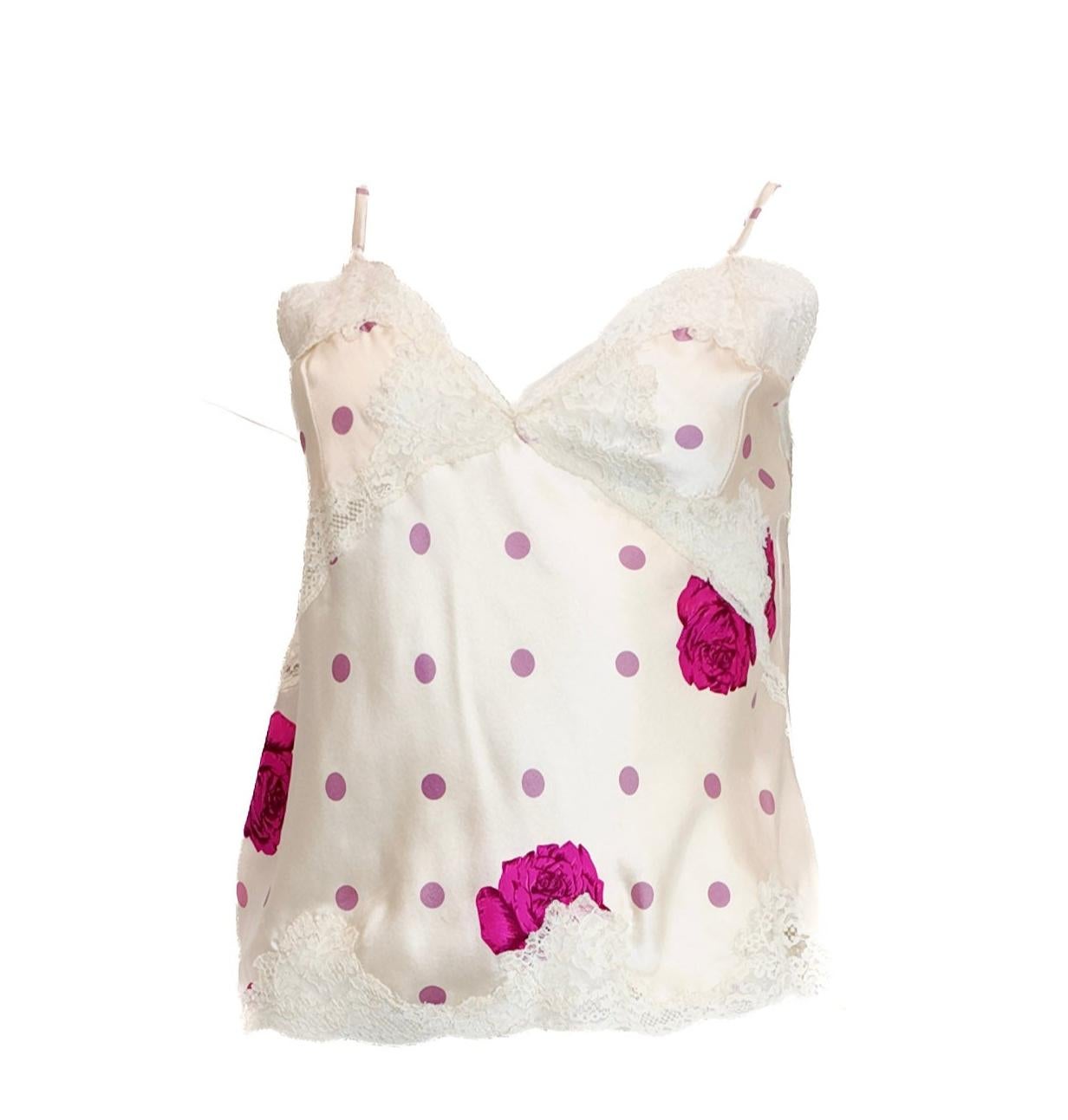 The Vintage Beige and Magenta Silk Rose Cami offers a timeless, elegant design perfect for versatile styling. Crafted from smooth silk, it can be worn alone for a delicate lingerie feel or layered effortlessly under a jacket or sweater. Its classic