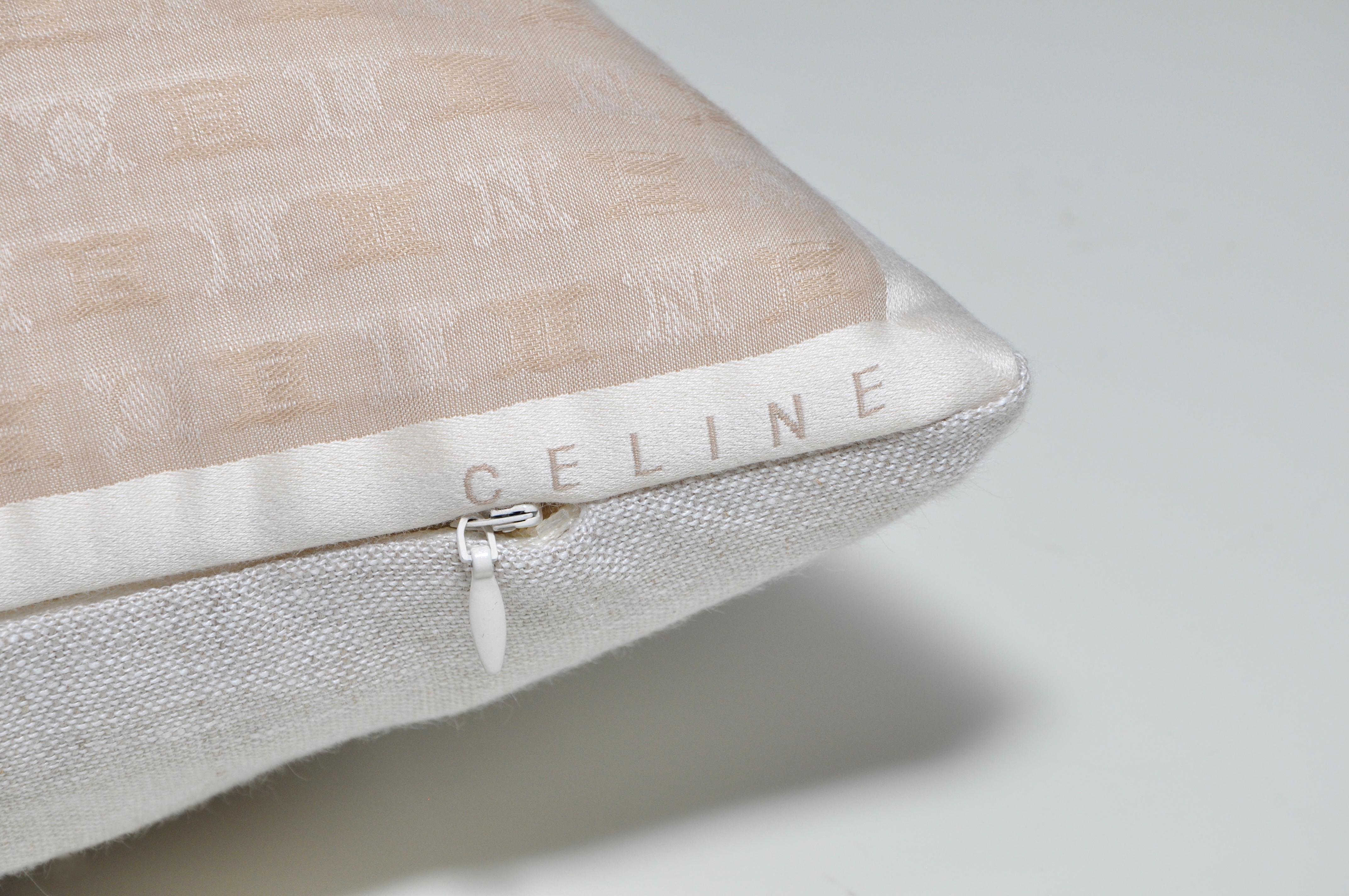 This cushion is a one-of-a-kind and part of a sustainability project. It has been created from an up-cycled, recycled luxury fabric, used with the intentions of promoting a more eco-friendly environment by using already existing materials. We both