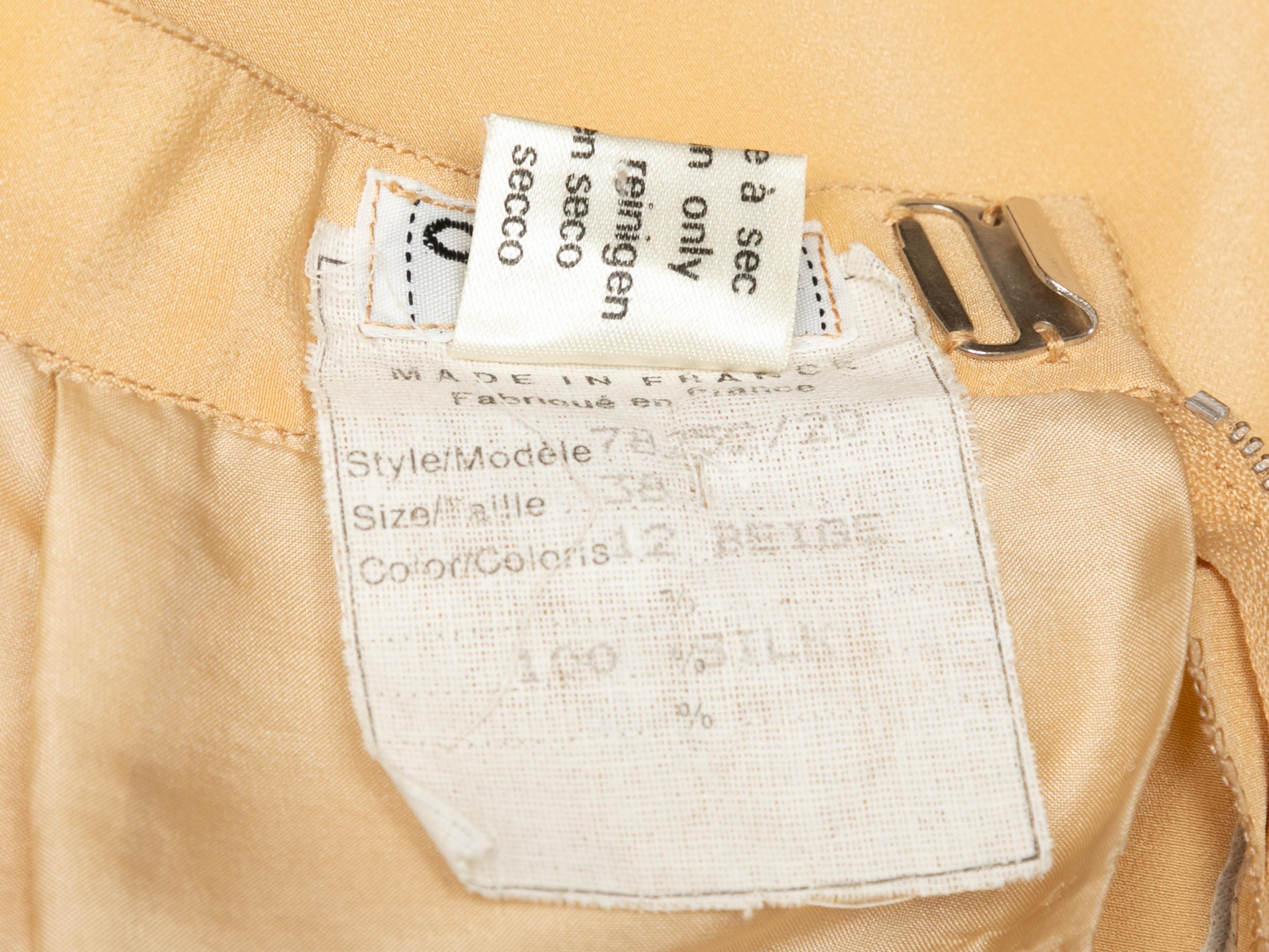 Vintage beige silk midi skirt by Chanel. Zip closure at back. 24