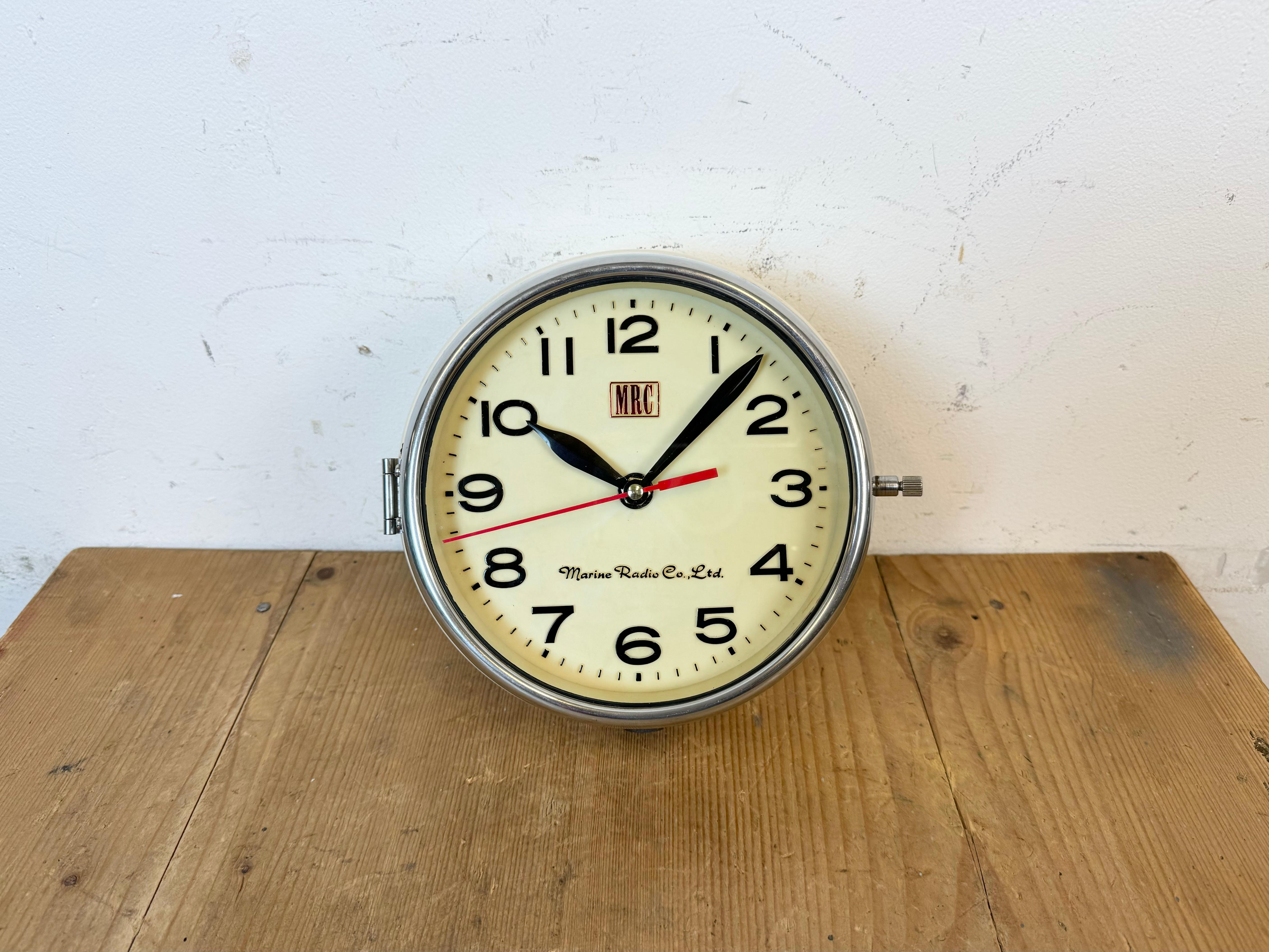 Vintage MRC ( Marine Radio Co. Ltd. ) maritime slave clock made in South Korea during the 1970s. These clocks were used on large Korean tankers and cargo ships. It features a beige metal body, a plastic dial and clear glass cover with chrome frame.