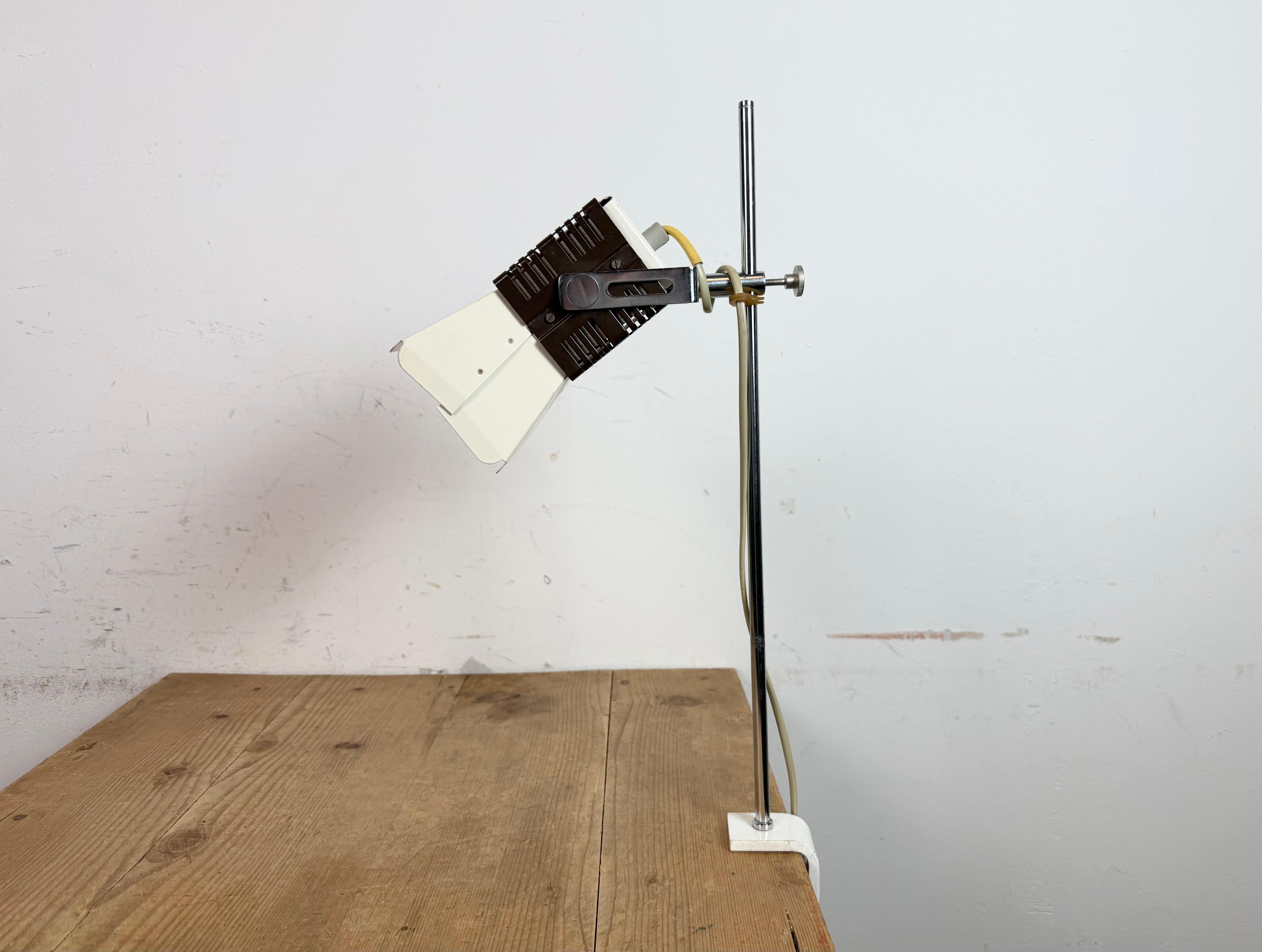 This height adjustable table lamp model L286 was produced by Lidokov and designed by Josef Hurka in former Czechoslovakia during the 1970s. It features a metal lampshade, a chrome plated arm and iron clamp base. The socket requires standard E27/E26