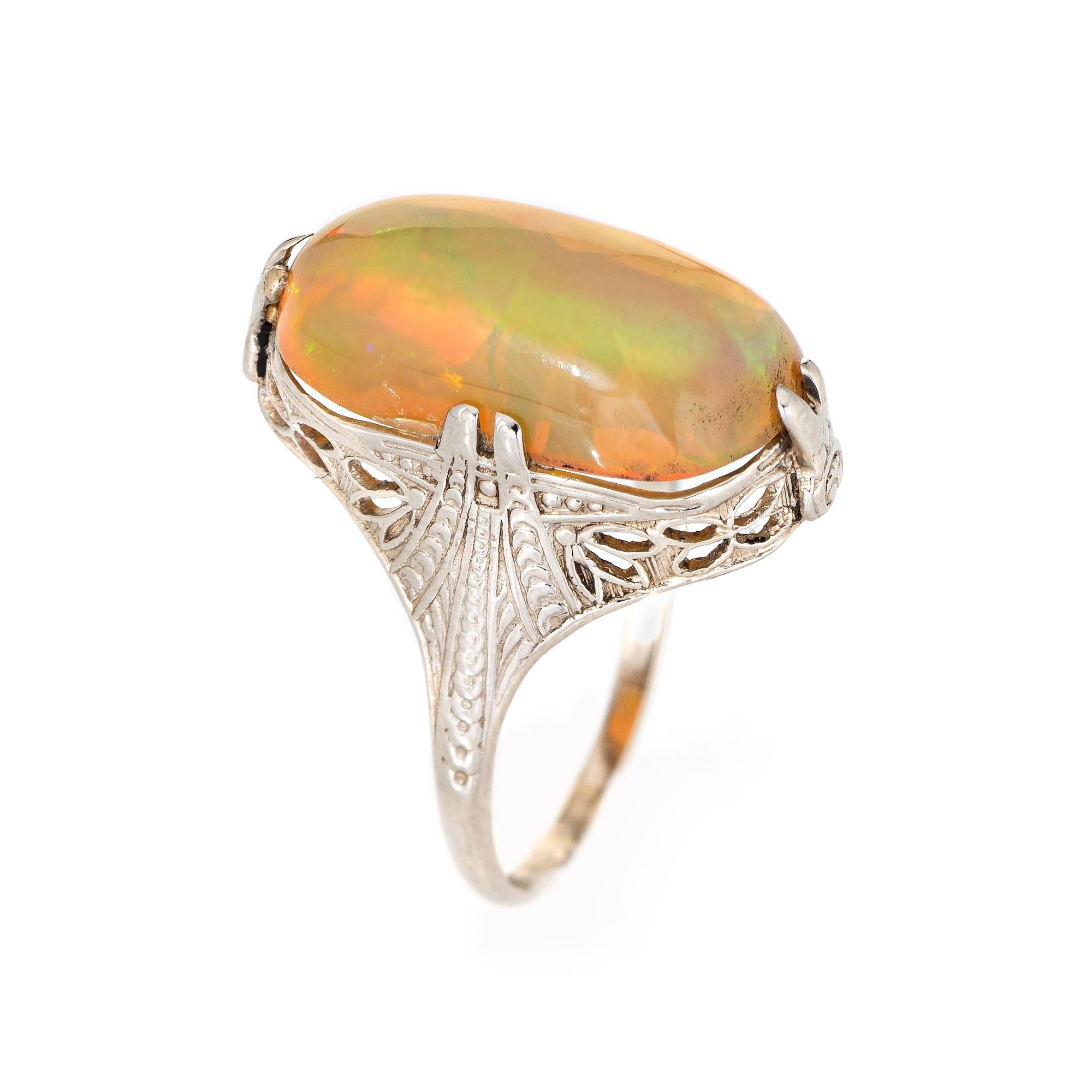 Elegant & finely detailed Belais Art Deco era ring (circa 1920s to 1930s) crafted in 14k white gold. 

Cabochon cut Ethiopian opal measures 15mm x 8.5mm (estimated at 4.50 carats). The opal is in very good condition and free of cracks or