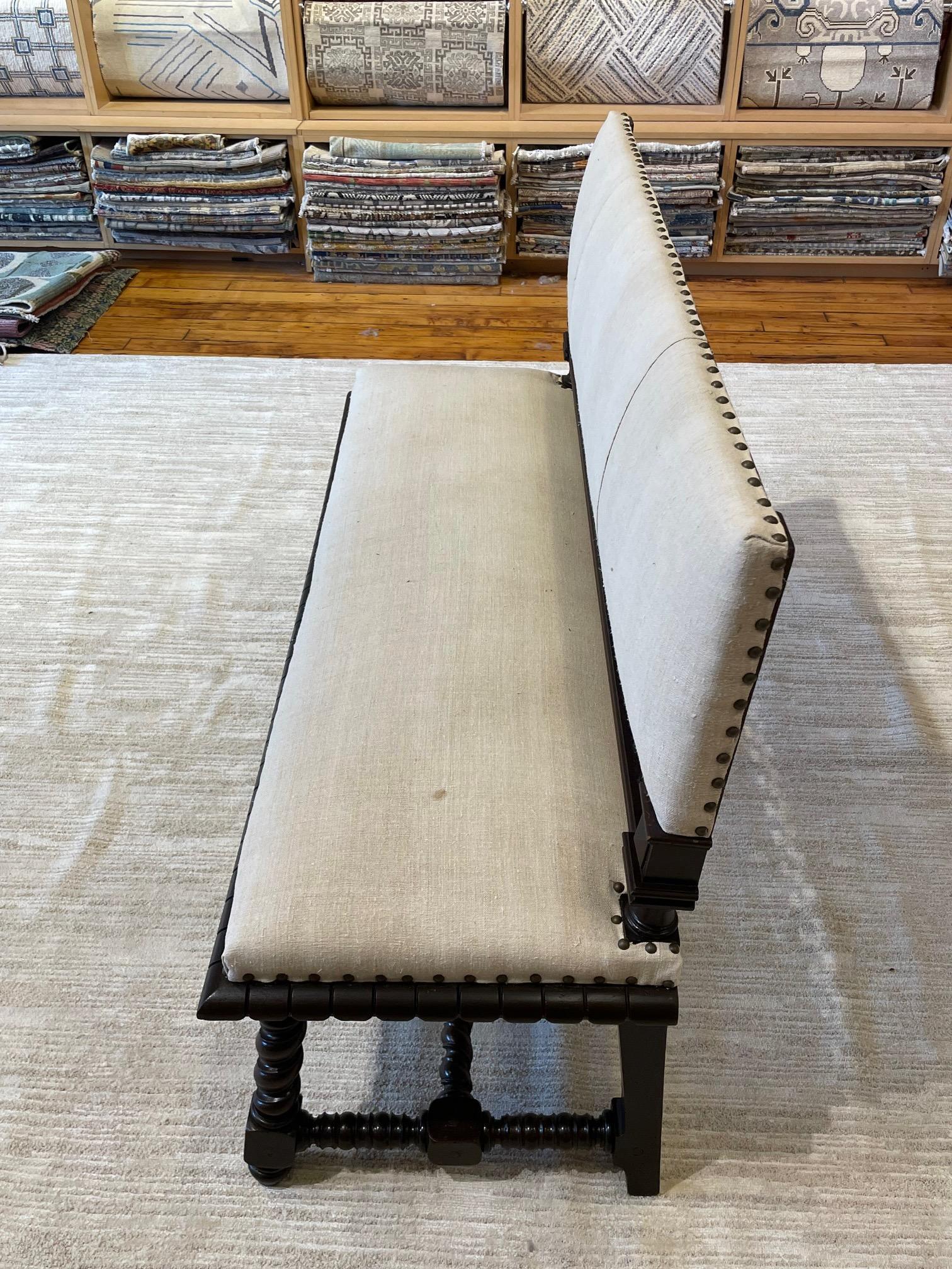 19th century French armless setee.
Spindle detailing along base of back.
Newly reupholstered in vintage Belgian linen.
Recently refurbished.
Also makes a great bench.