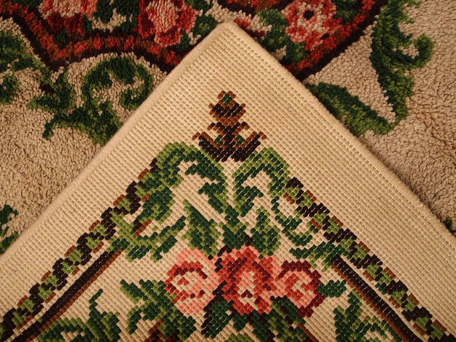 Vintage European Savonnerie rug in original good condition made from the soft wool. The beautiful garden design in green and red shades on the beige background. 

-Condition: original good,

-Circa: 1960s,

-Size: 6.5' x 9.8' (199cm x