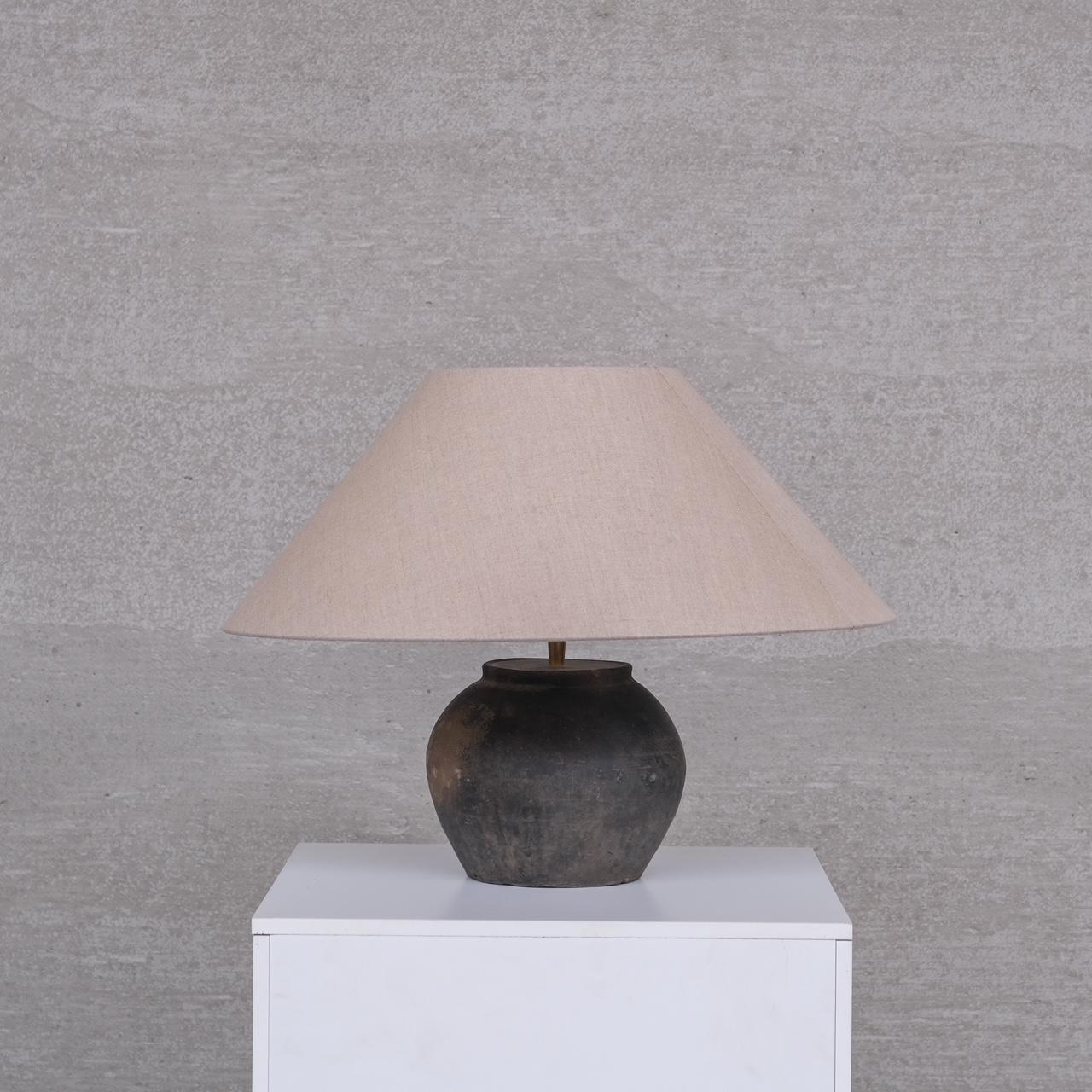 A petite ceramic table lamp with modern new shade.

Belgium, c1950s,

Since re-wired and PAT tested.

Dimensions without shade: 25 Diameter x 19 H in cm.

Good vintage condition, occasional scuffs and signs of wear.

Internal Ref: 03/03/25/000.