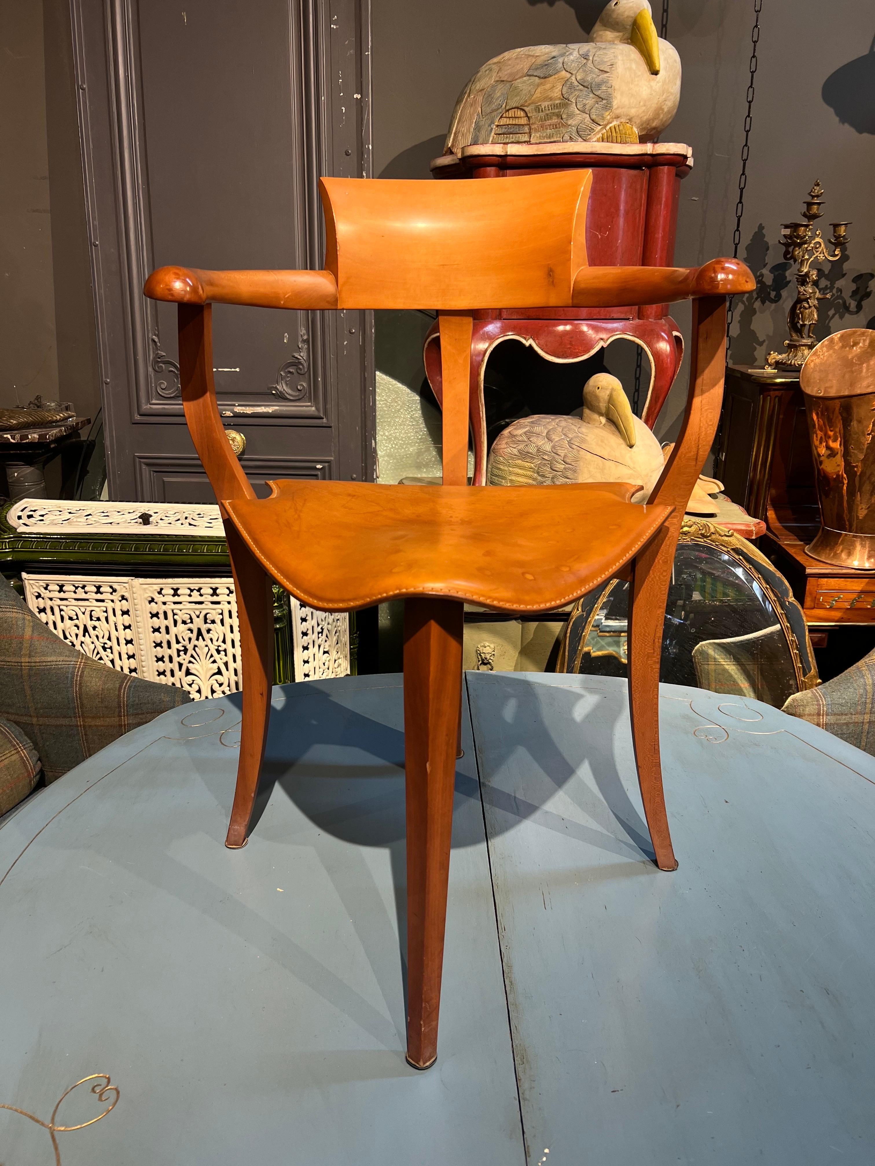 Vintage single side chair made of fruitwood in hand carved frame with matching leather seat. Very comfortable shape and original good condition.
Belguim, circa 1950 