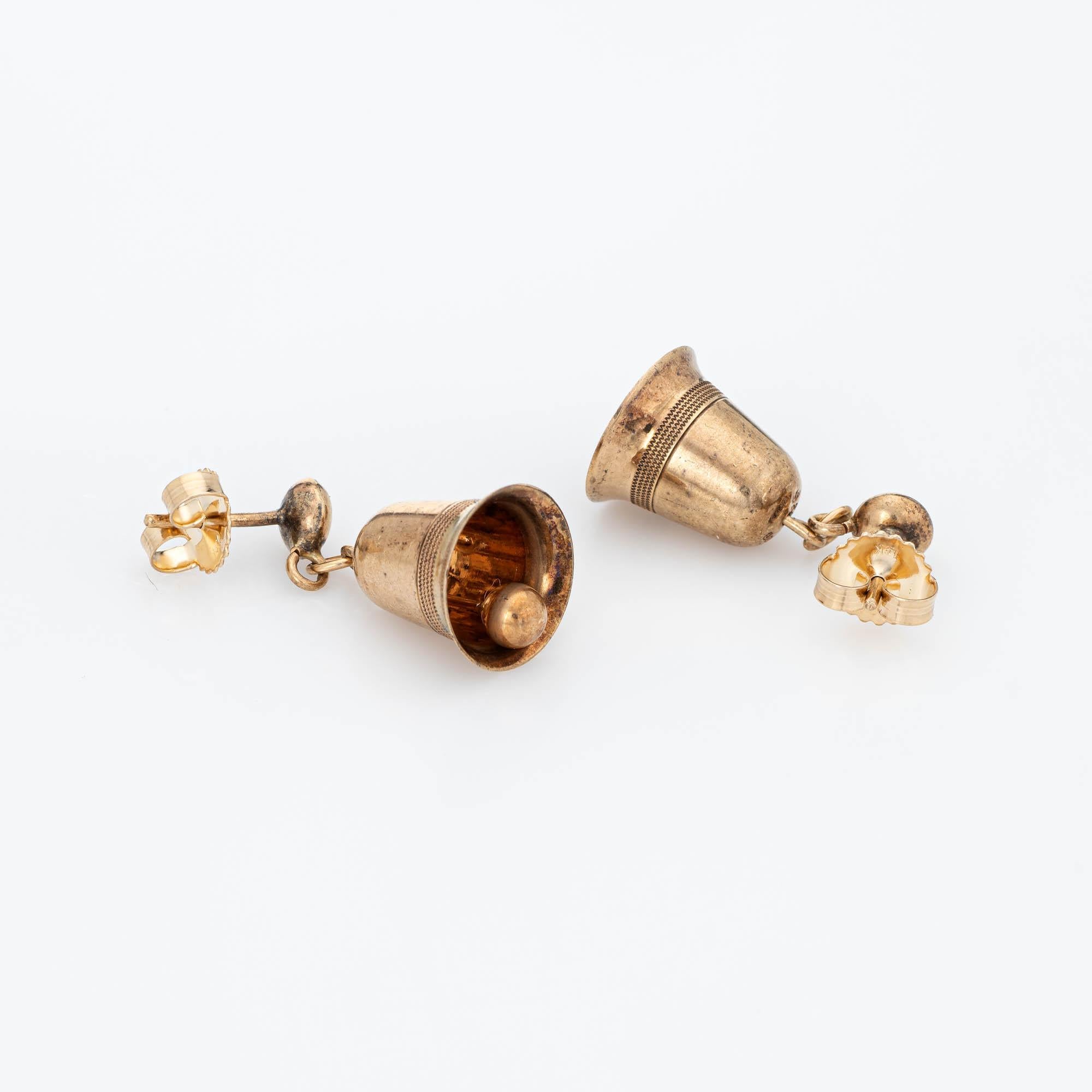 Finely detailed pair of vintage bell earrings (circa 1953) crafted in 9k yellow gold. 

The sweet earrings are crafted in the form of a bell, a likely creation and nod to a wedding celebration. The earrings move freely with a soft chime from the