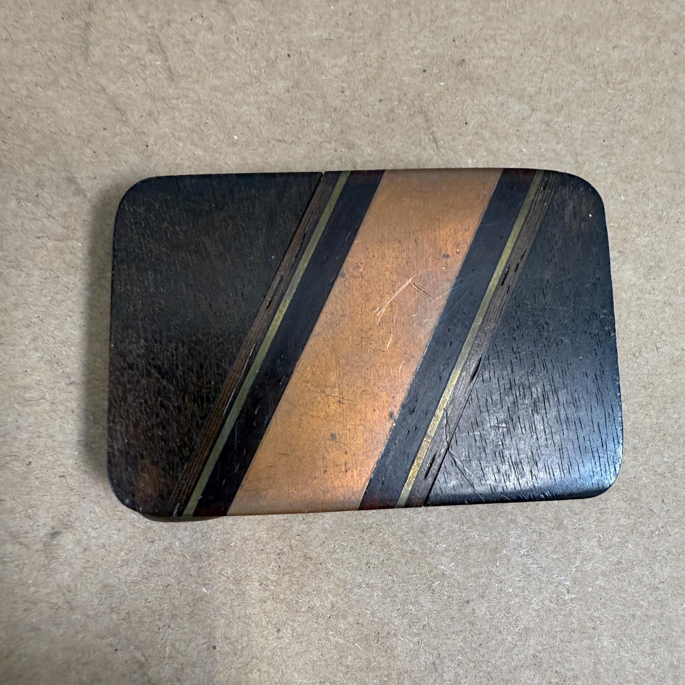 AMBIANIC presents
Modern Exotic Wood Brass and Copper Vintage Belt Buckle
2. 25 x 1.5 x .25
Preowned original vintage condition
Please refer to images provided.