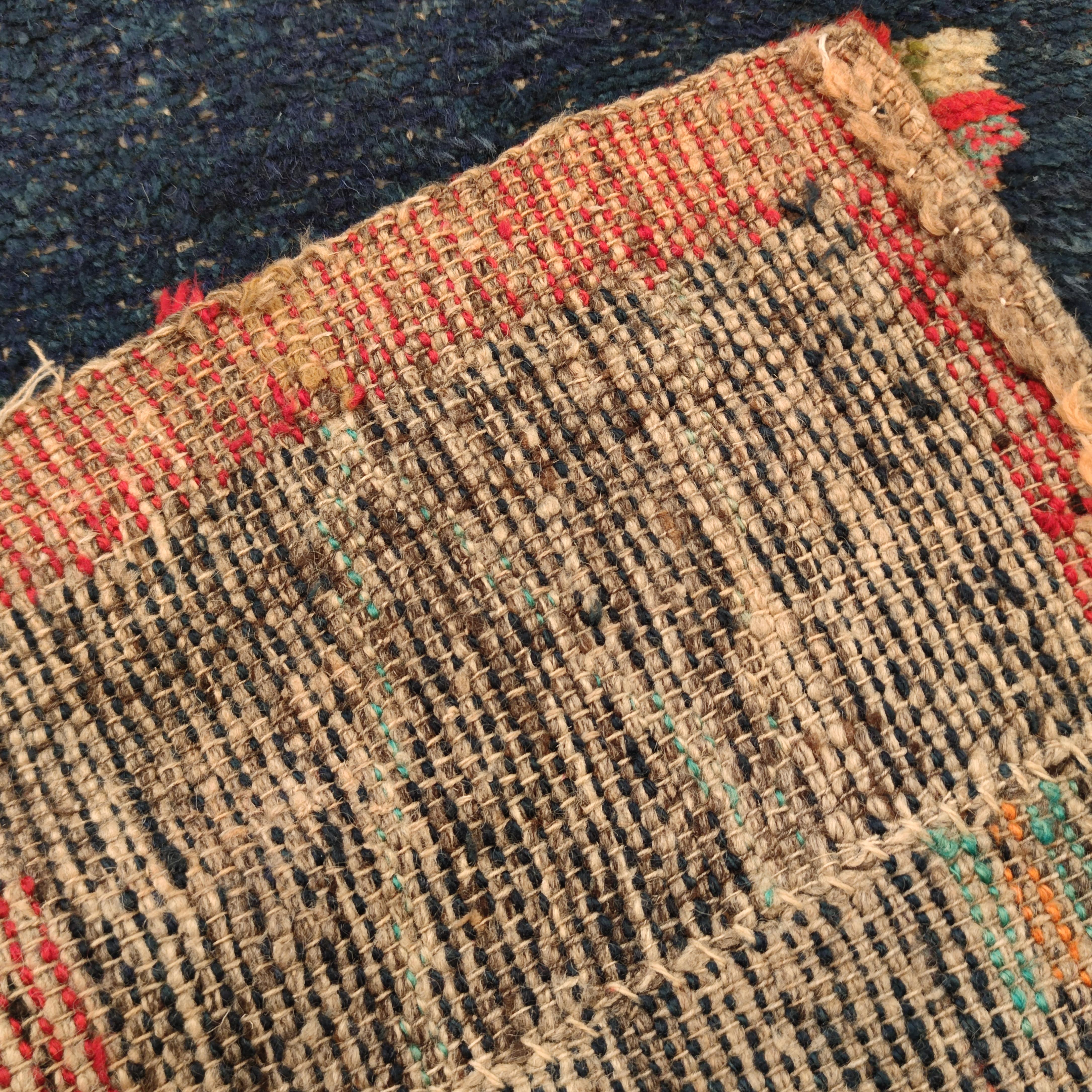 A curious pictorial rug, woven by the Afghani Beluch people, illustrating a map of Afghanistan divided into regions at around the time of the Gulf war. It belongs to the larger group of so called ‘Afghan war rugs’ and depicts a completely different