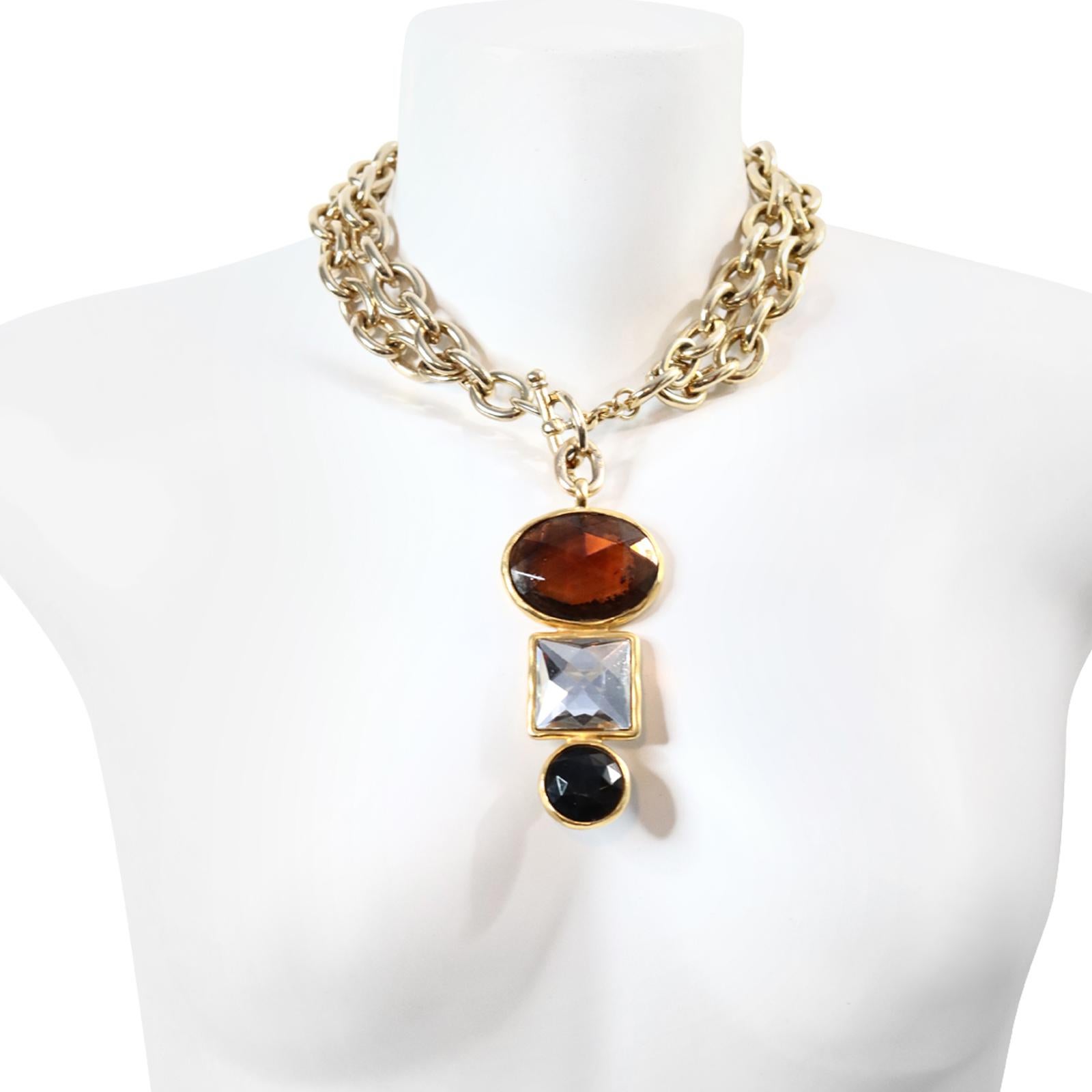 Vintage Ben Amun Gold Tone with Dangling Crystal Crystal Necklace Circa 1980s. This necklace is composed of a heavy-link chain that can be worn as a single long necklace or lariat style or as shown with a double. It features a toggle that allows you