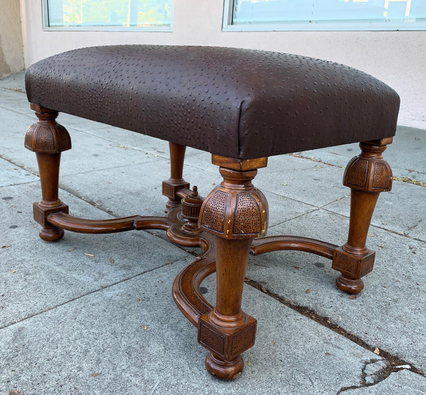 Beautiful vintage bench upholstered in a chocolate brown faux ostrich print leather, the bench is newly upholstered, the legs are in good condition with some nicks and mild scratches.
Measurements: 
28