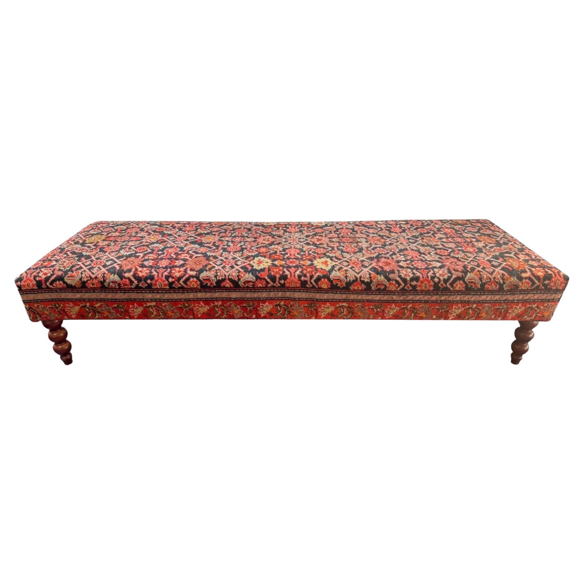 Vintage Bench Upholstered in an Early 20th Century Rug with Turned Legs For Sale