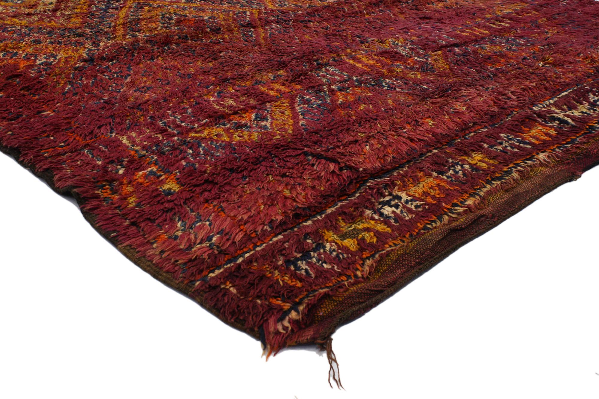 20158 Vintage Beni MGuild Moroccan Rug, 05'09 X 09'10. Imbued with a delightful bohemian flair and an infectious vitality, this hand-knotted wool vintage Beni M'Guild Moroccan rug envelops a room in a kaleidoscope of raspberry hues adorned with
